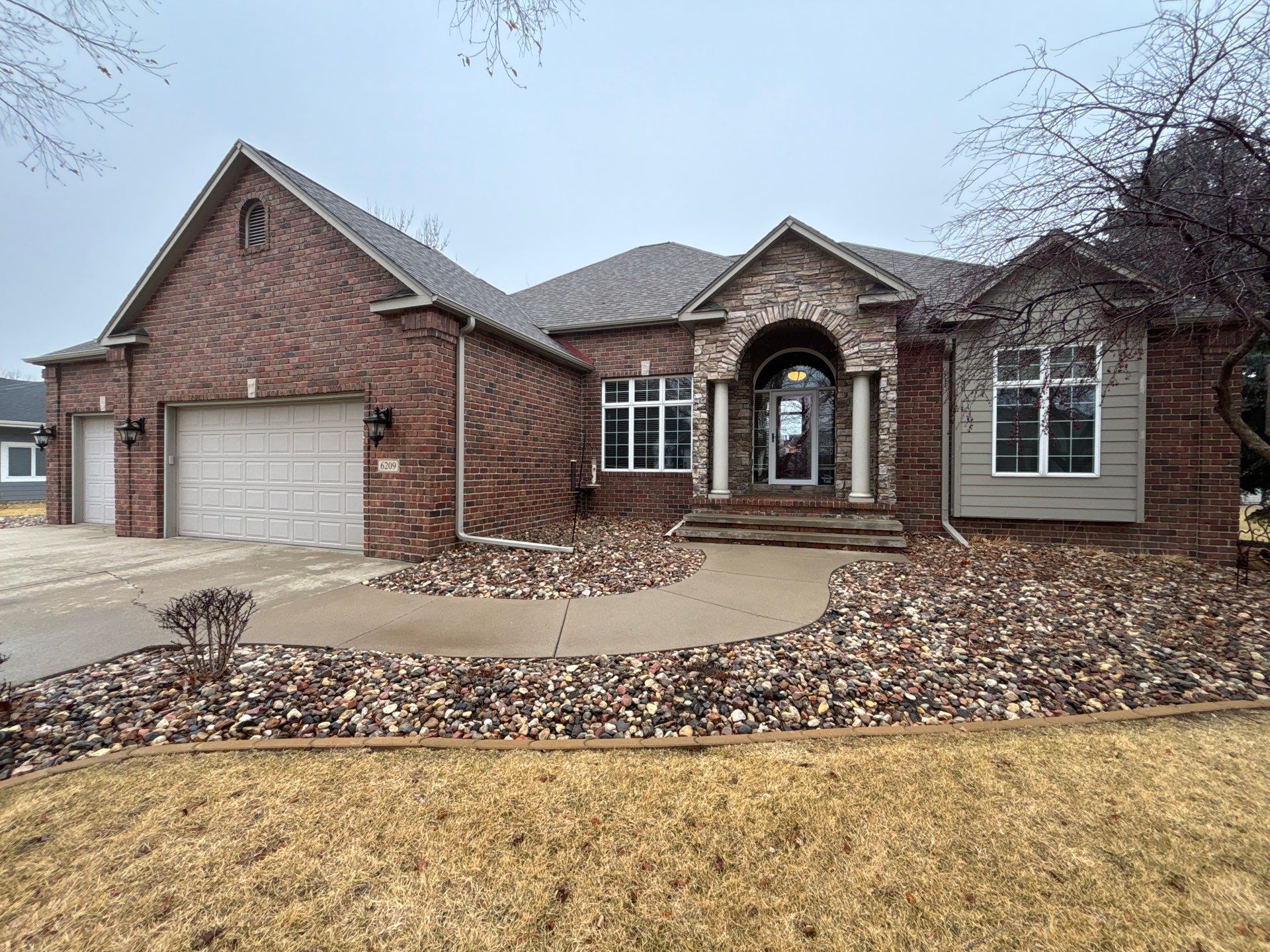 Sioux Falls Concrete Driveway Replacement and Custom Front Walkway by Select Painting, Coatings & Garage Cabinets