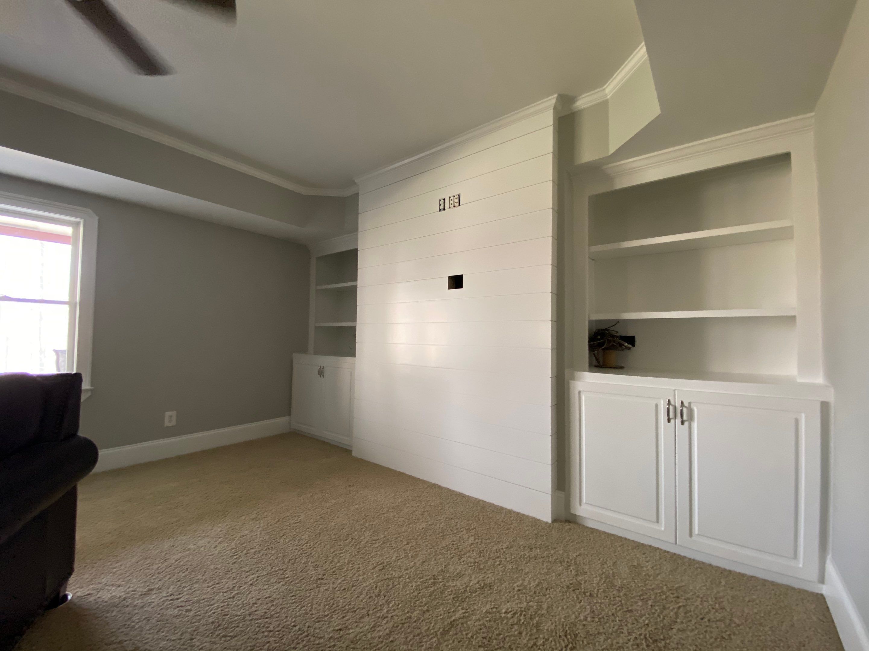 Finished Basement Renovation with Custom Shiplap and Modernized Wood Railings by Swift Home Renovations 