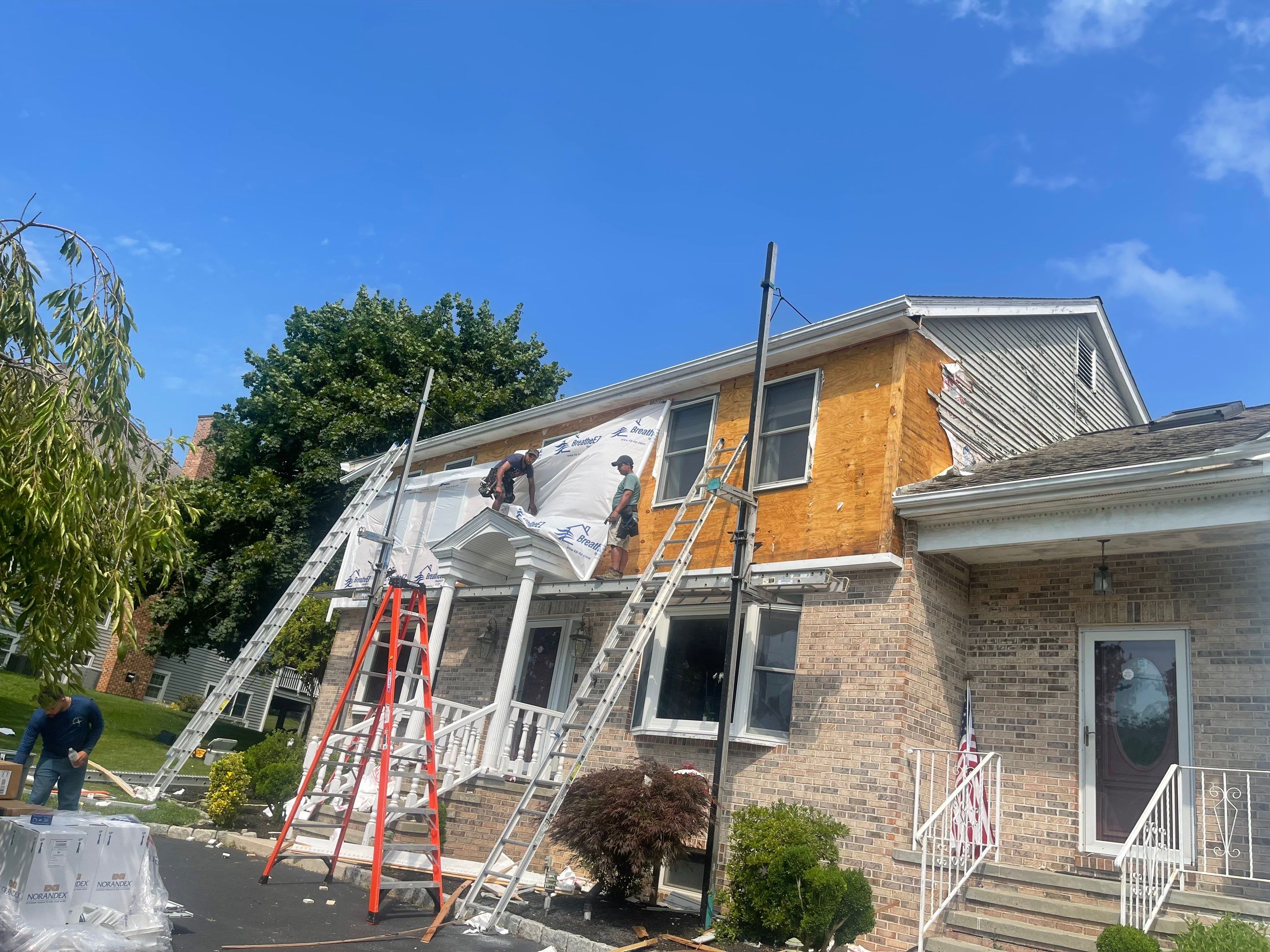 Siding Installation using Mainstreet Colonial & White gutters by A Plus Exterior