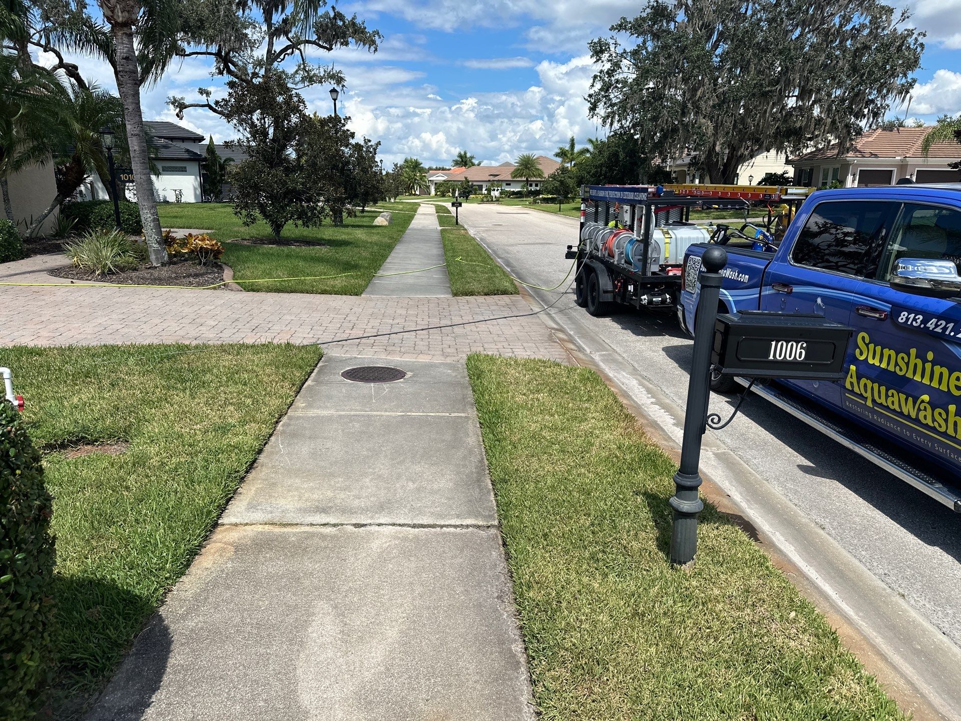 Paver Driveway, Entryway, Sidewalk, and Street Curbing Cleaning in Winding River Community, Bradenton, FL by Sunshine AquaWash