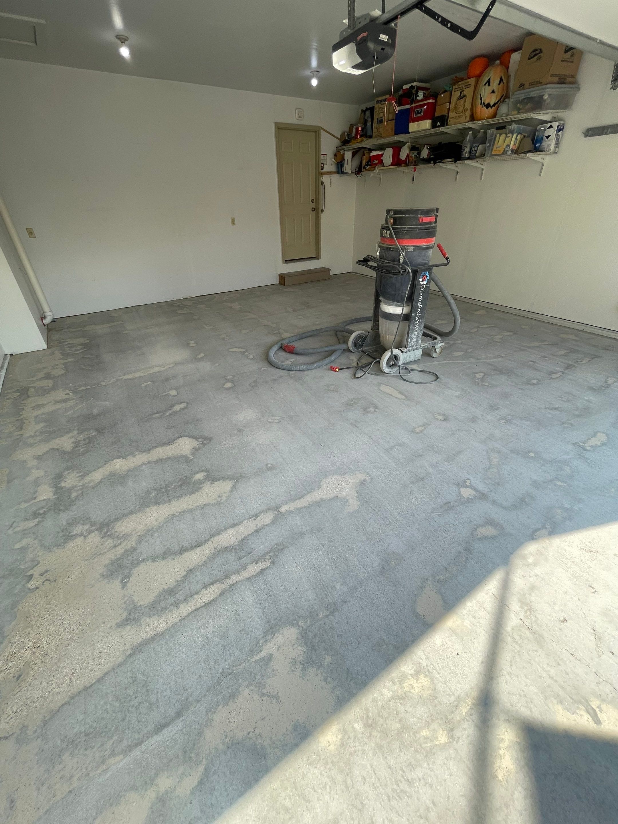 Sioux Falls Residential Garage Floor Coating with Speckled Epoxy Finish by Select Painting, Coatings & Garage Cabinets