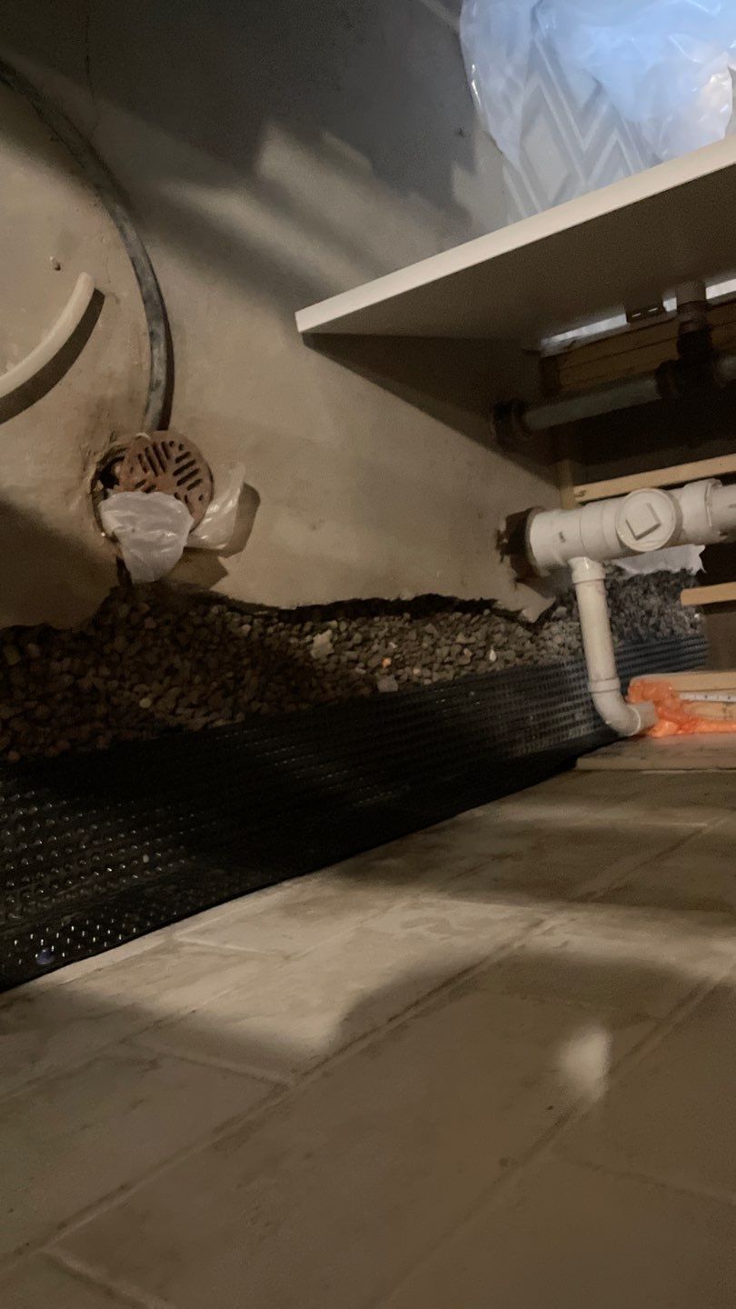 Interior Drain Tile & Buried Discharge in St. Anthony, MN by Waterproofing Northeast