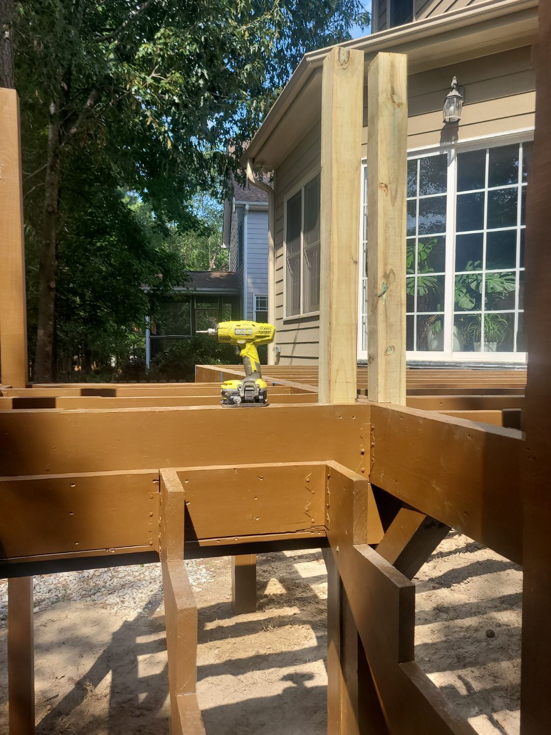 Fuquay-Varina Outdoor Upgrade – Composite Deck & Paved Landing by Elite Remodeling and Design LLC