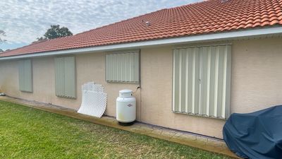 Ivory Accordion Shutters