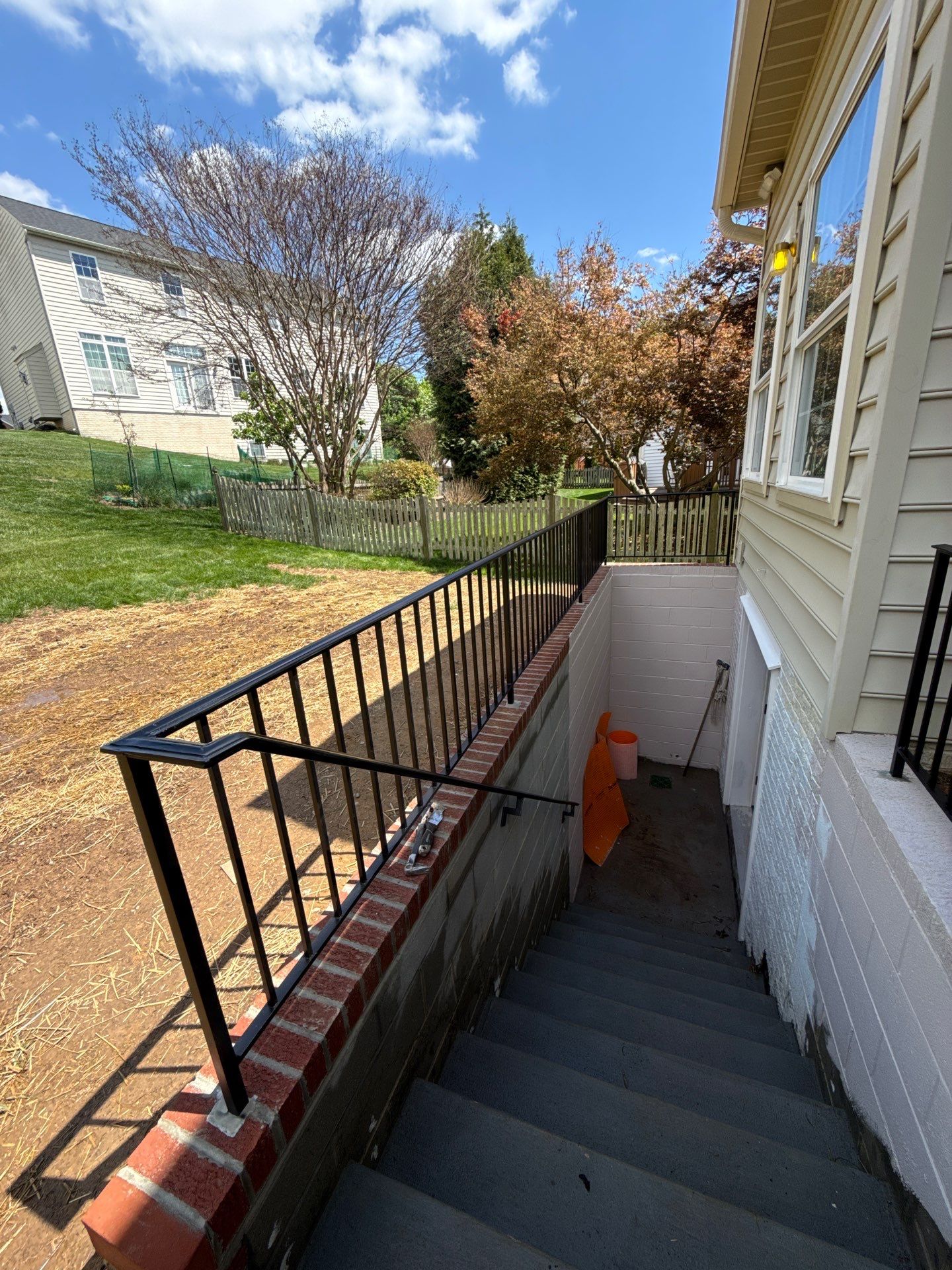 Basement Stairwell and Window Well Railing Installation in Germantown by Capitol Iron Works