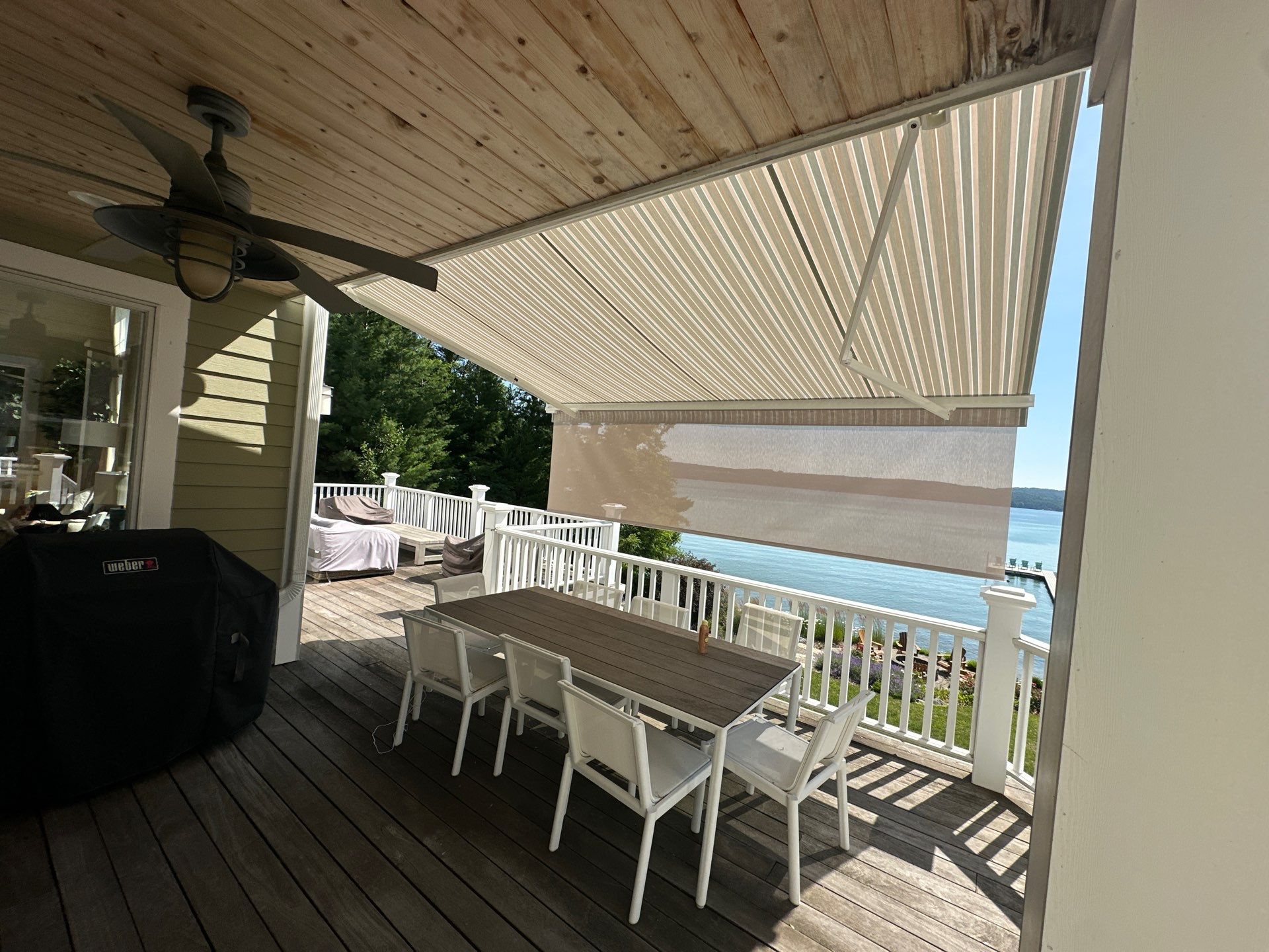Sunesta Retractable Awning Installation for Lakeside Deck in Kewadin by Rainbow Seamless Systems