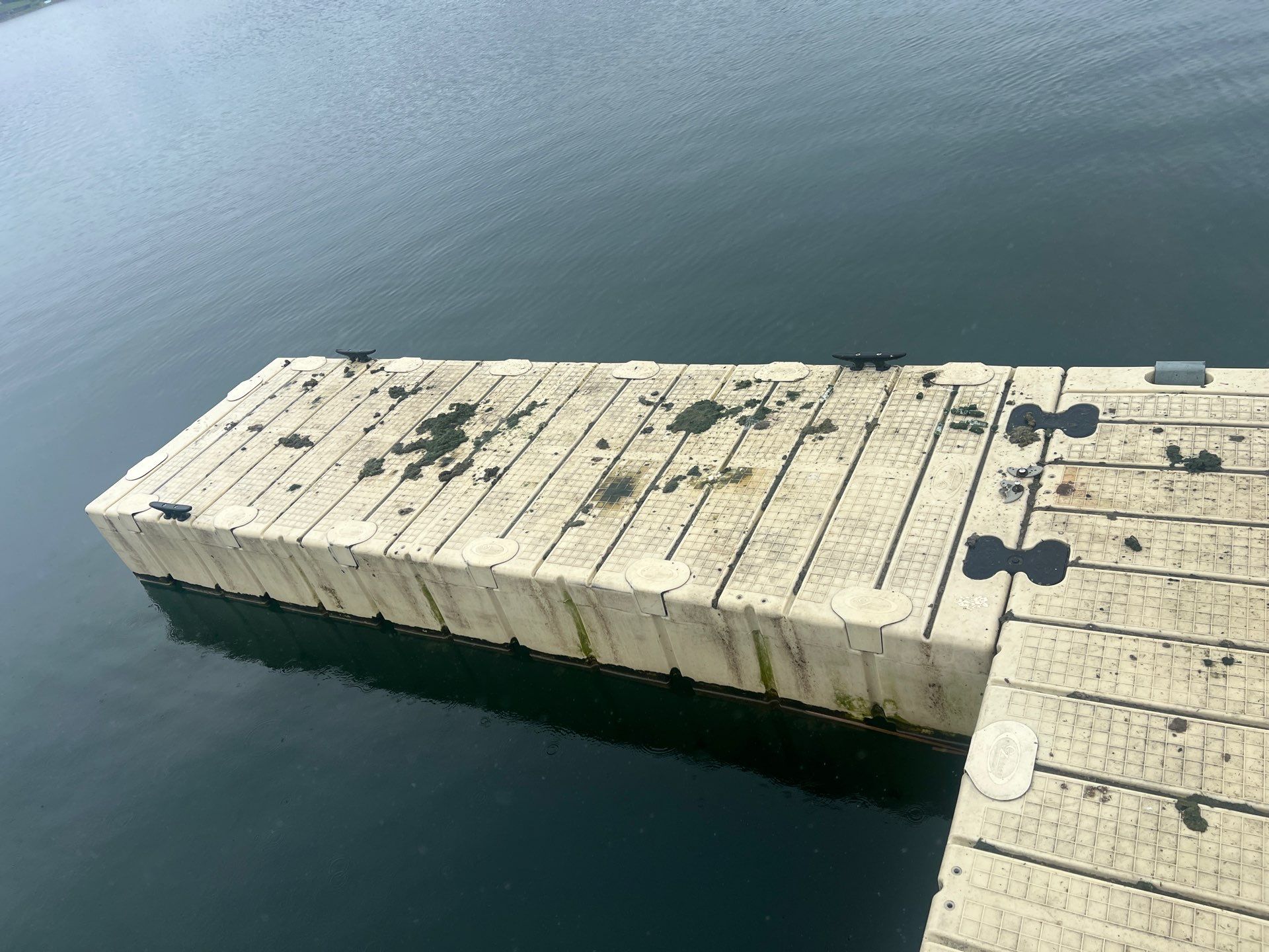 Power washing of floating dock by Northern Power Washing LLC.