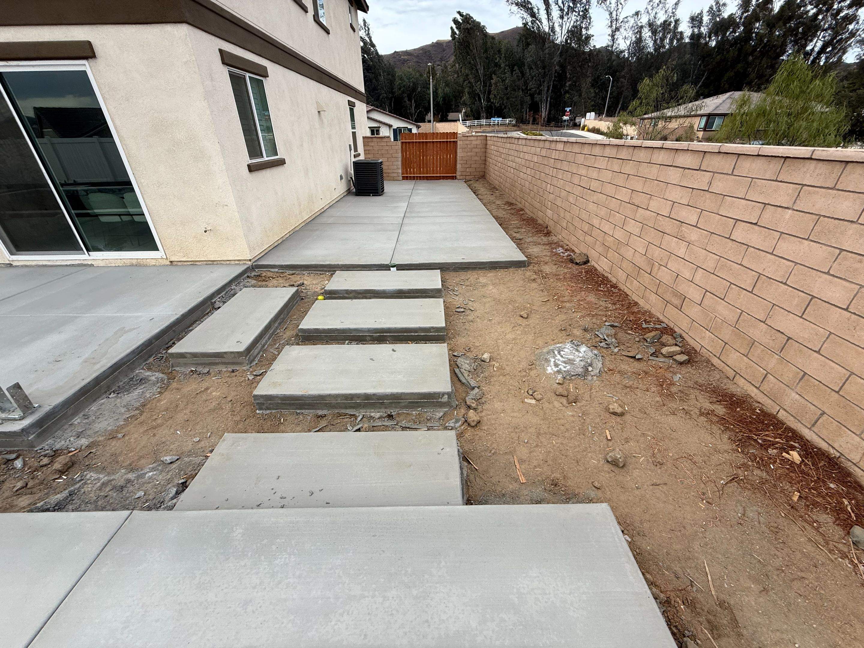 Pool and spa modern shape turf around pool by Premier Pools and Spas Temecula