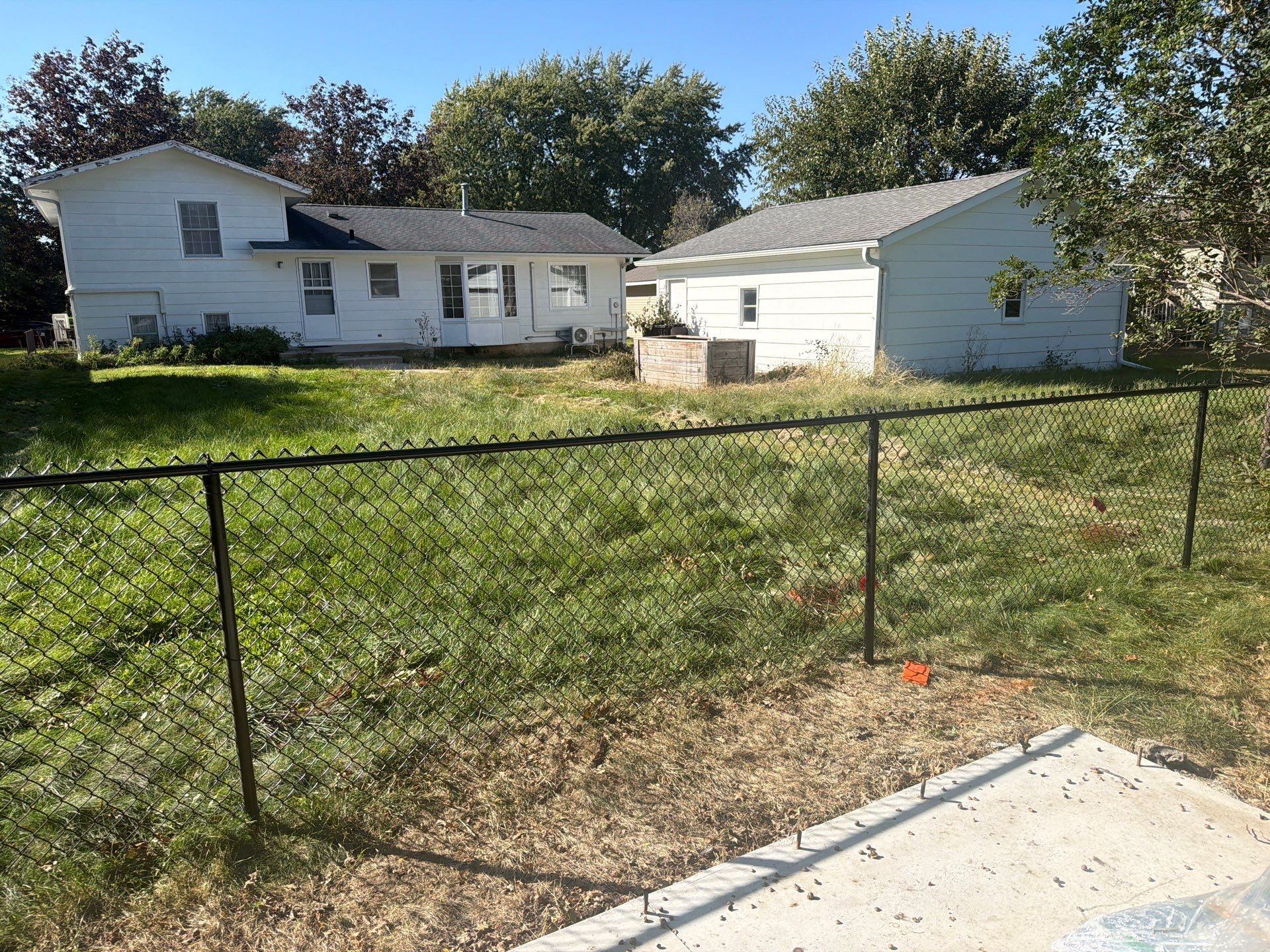 Black Chain Link Fence Installation with Double Gate in Cedar Falls by Perfect Picket Fence and Stain