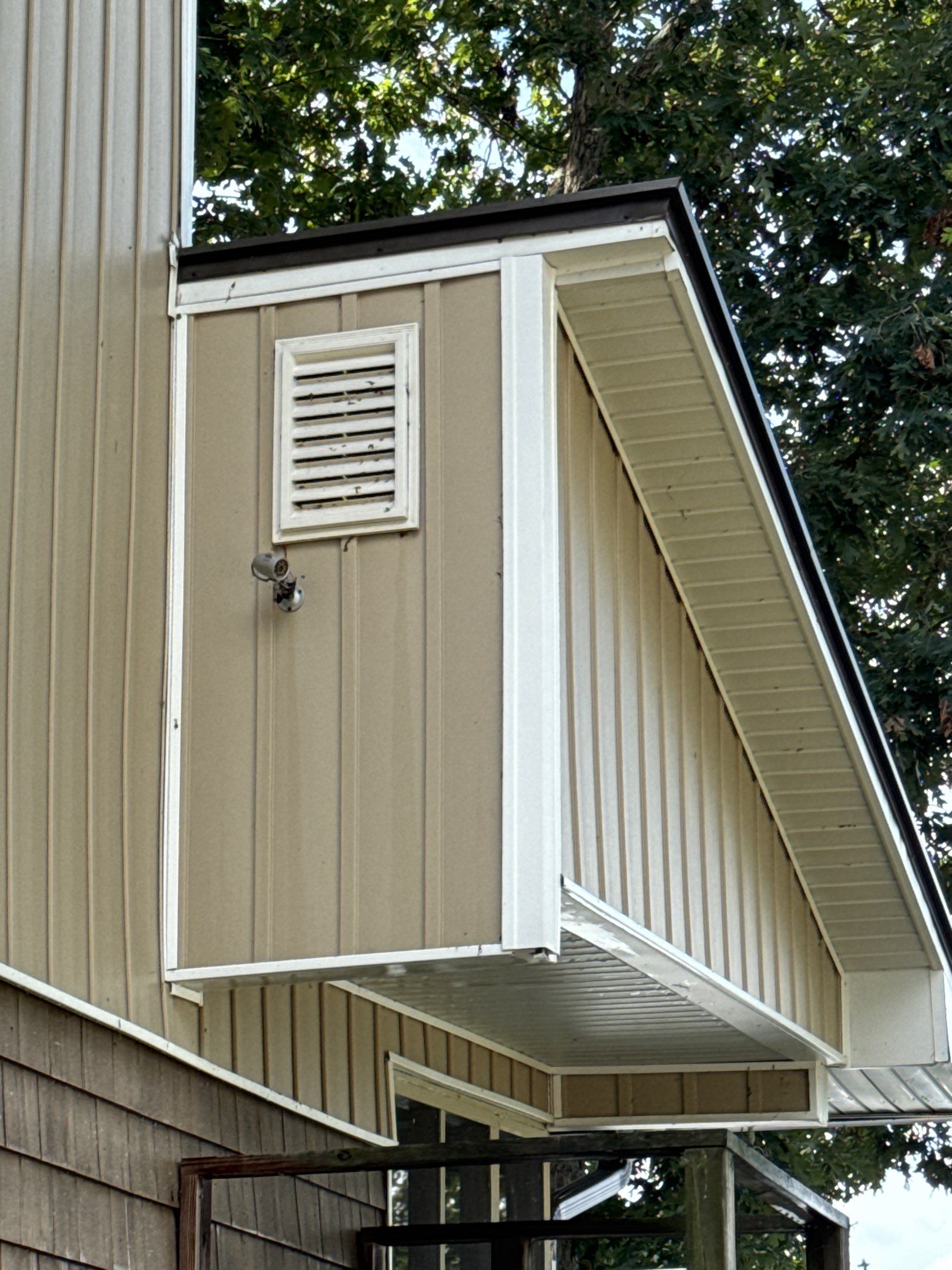 the service being done is cleaning the exterior siding and soffit of a house to remove dirt and stains