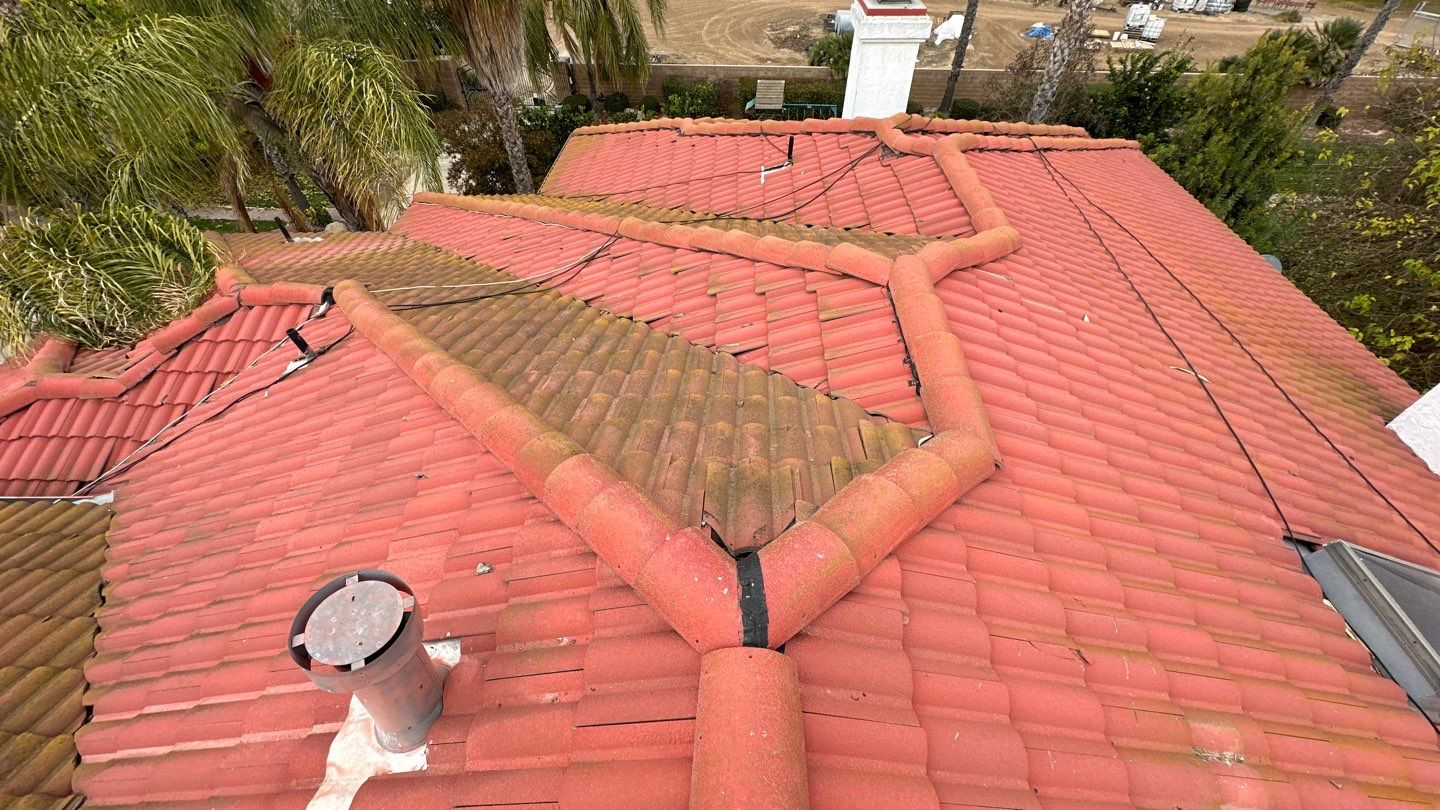 Tile refurbish project using existing tiles and replaced underlayment and battens by Straight Edge Roofing Inc