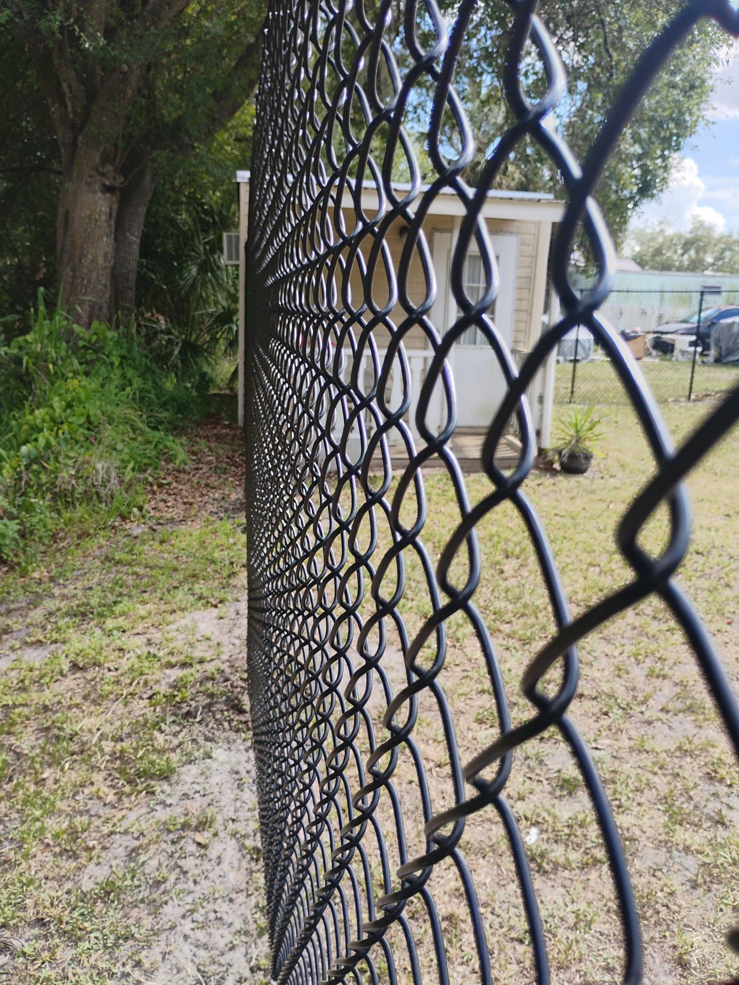 Black Vinyl Chain Link Fence Installation in Arcadia Florida by True Fence LLC