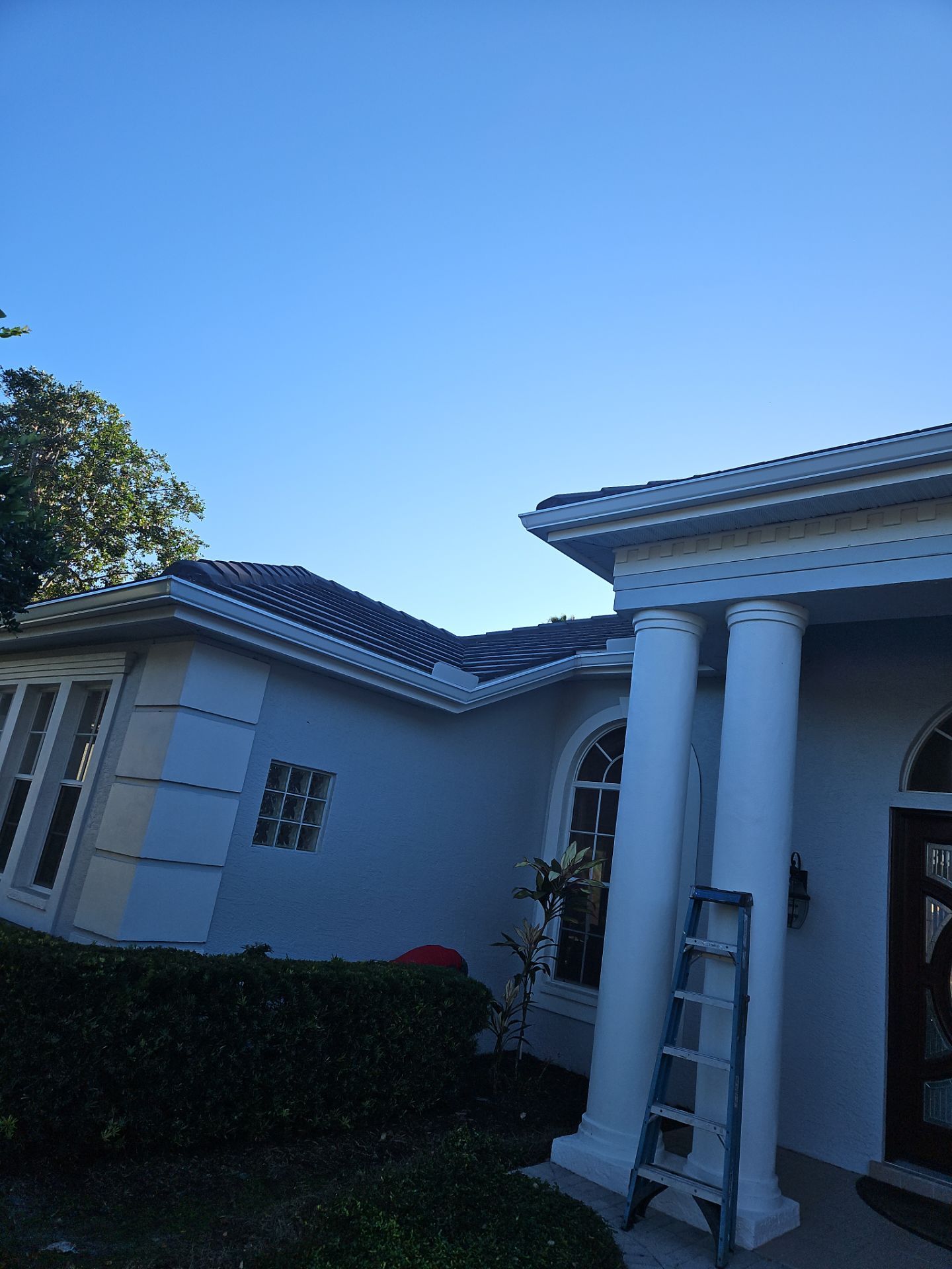 White Down Spouts using downspouts and White Seamless Gutters in Sarasota FL by Gutter Professors