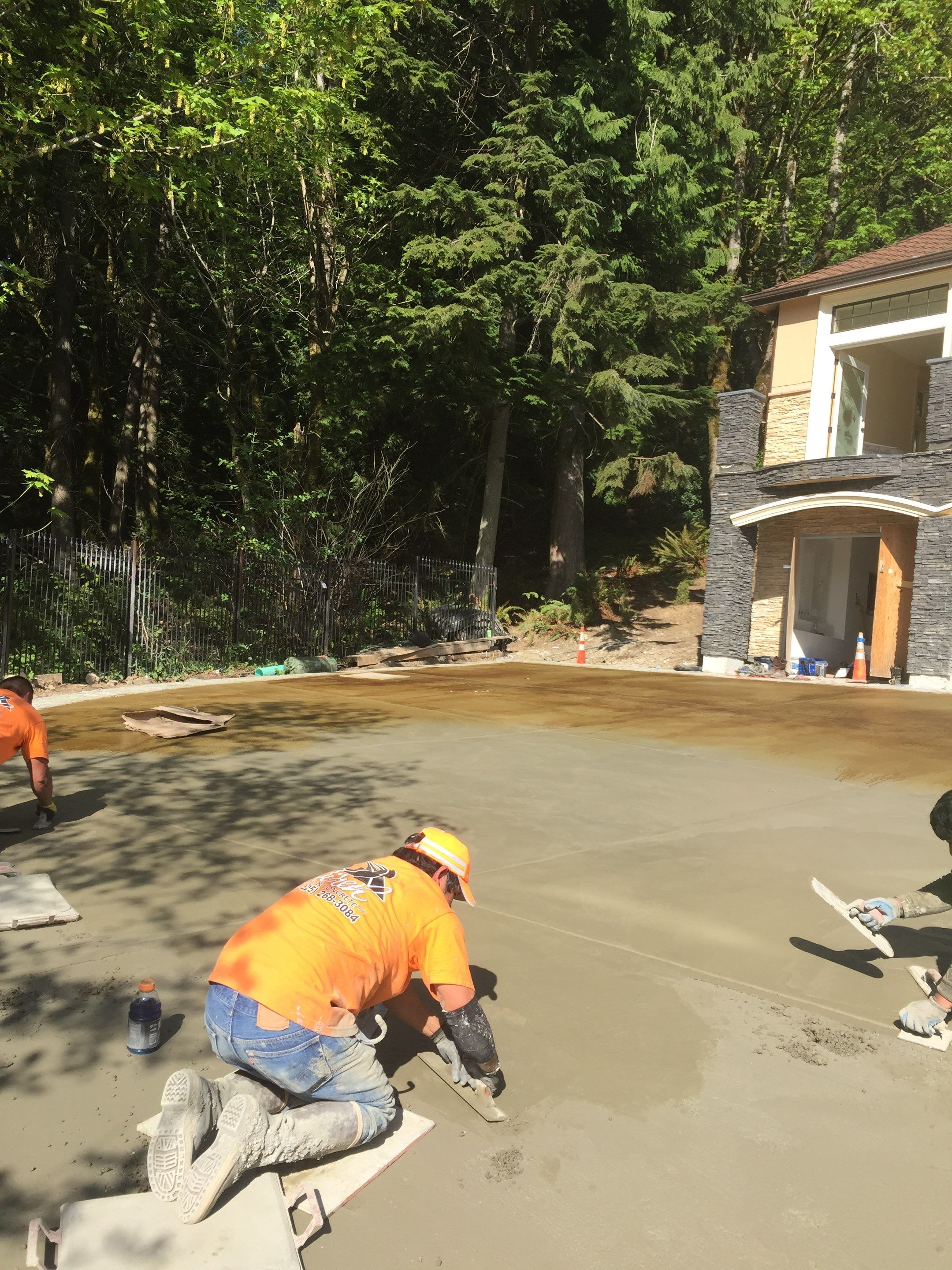 Asphalt Driveway and Stamped Concrete Patio Finish  by Jireh Asphalt & Concrete Inc 