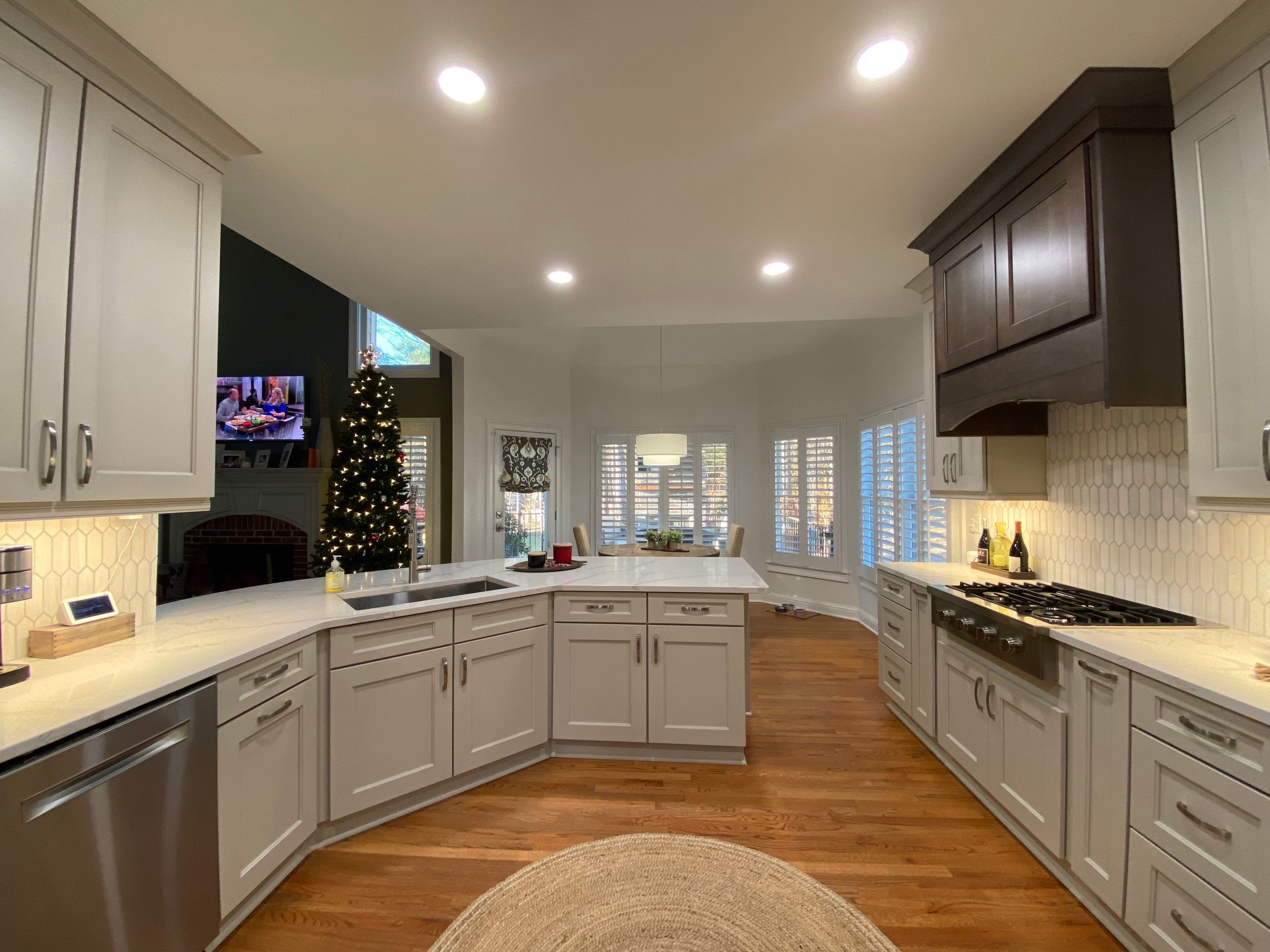 Modern Kitchen Remodeling with Quartz Island and Custom Vent Hood in Woodstock by Swift Home Renovations