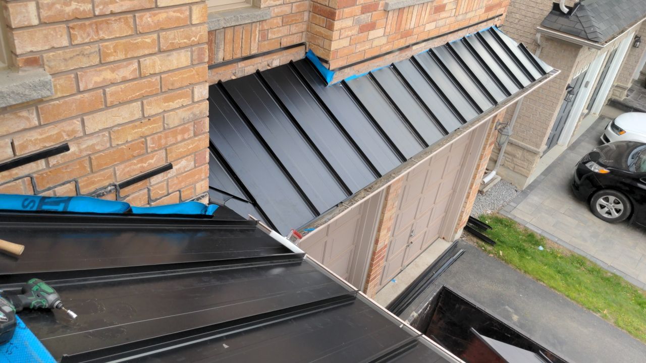 Residential Roofing Installation using 16" Standing Seam Panels by Jay Carter Roofing & Sheet Metal