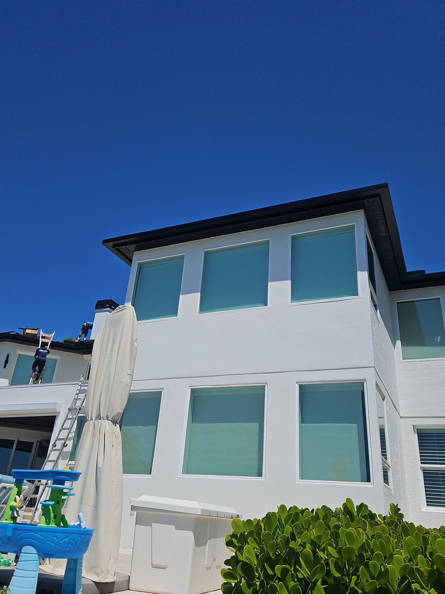 Soffit and Fascia Installation and black seamless gutters in Sarasota FL by Gutter Professors