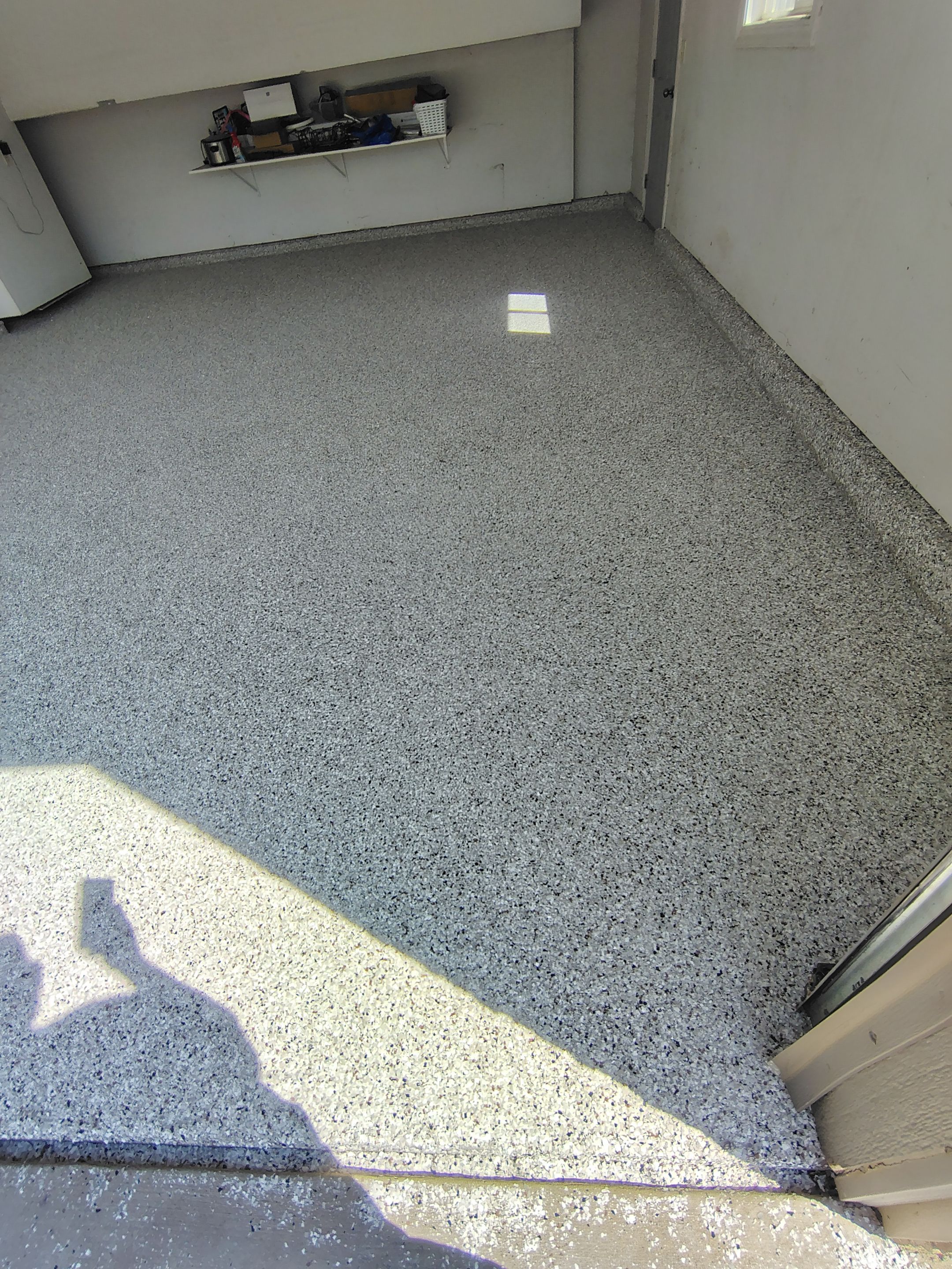 Decorative Chip Epoxy Garage Floor Coating in Sioux Falls by Select Painting, Coatings & Garage Cabinets