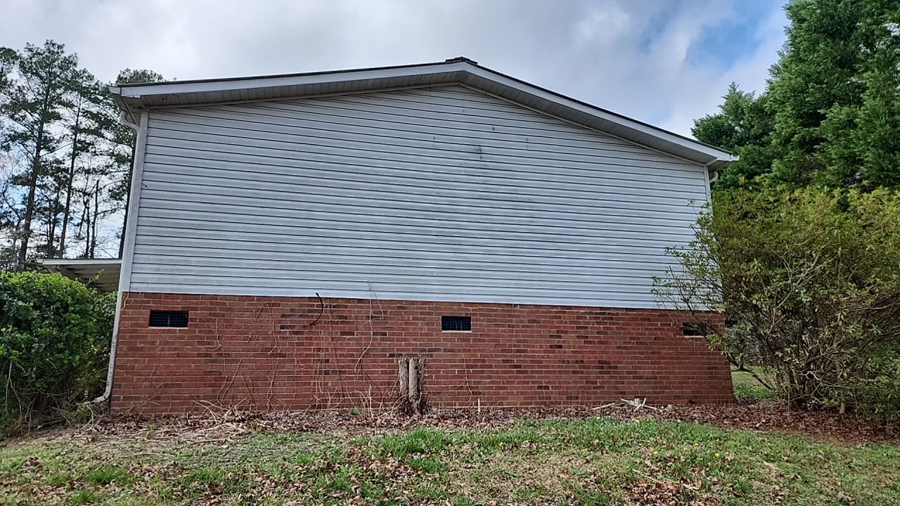 House Wash using cleaner by Power Wash Masters LLC
