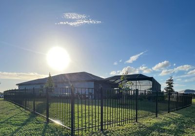 Aluminum Fence Installation using Black 3 Rail Aluminum Fence