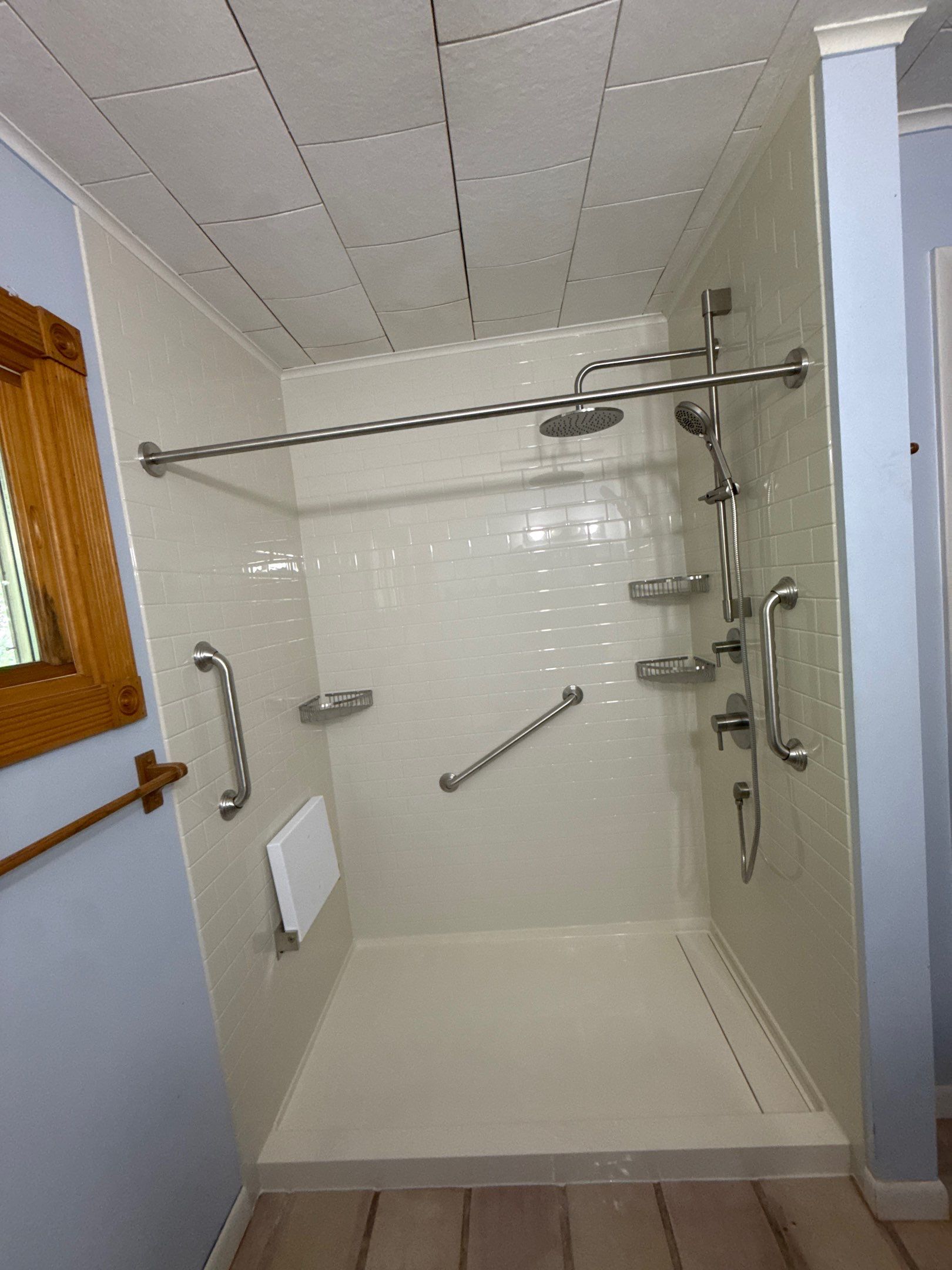 White Subway Tile Walk-In Shower Conversion in Cadillac by Rainbow Seamless Systems