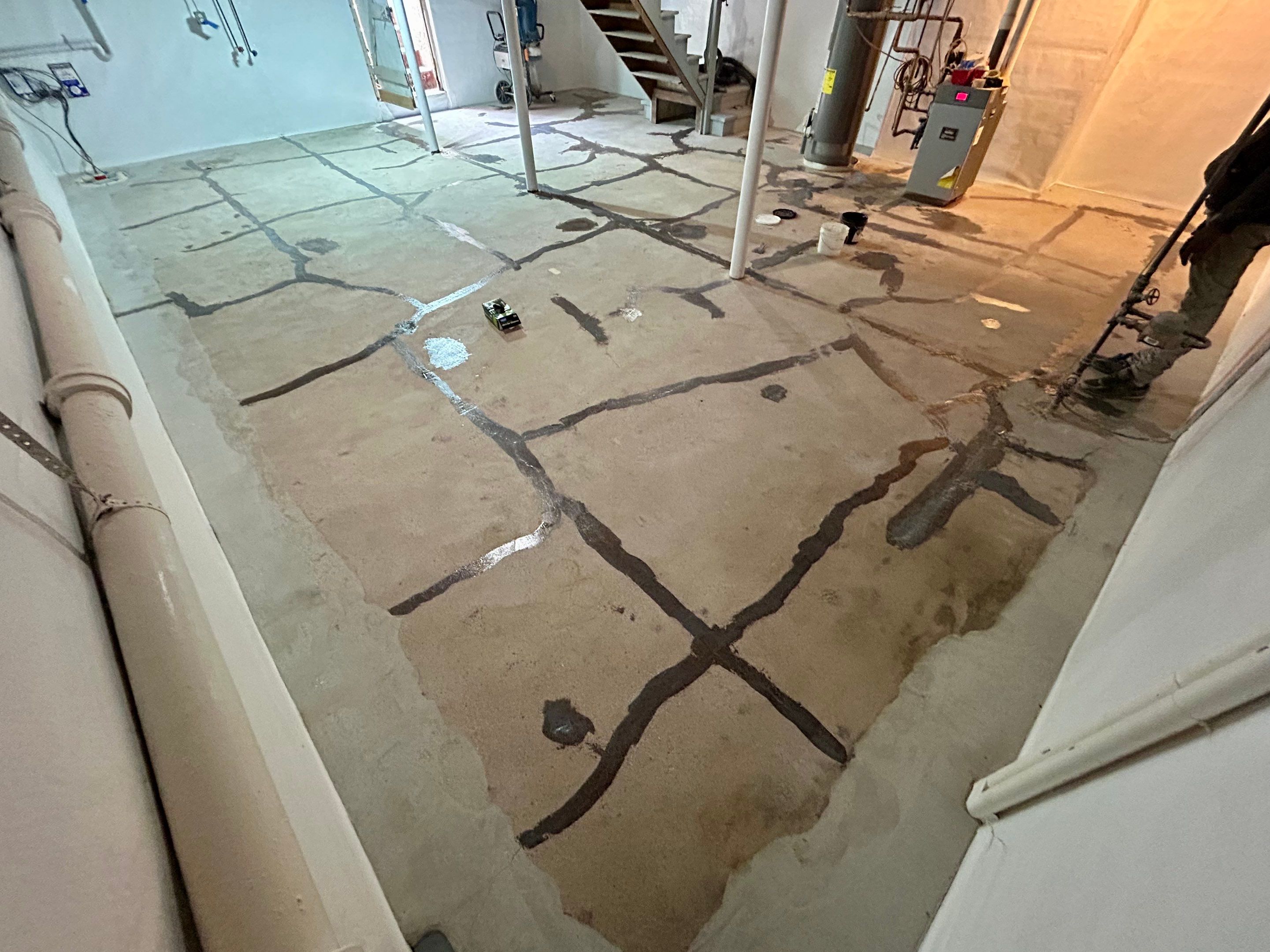 Basement floor Coating Transformation by DiGiorgi Roofing and Siding Inc