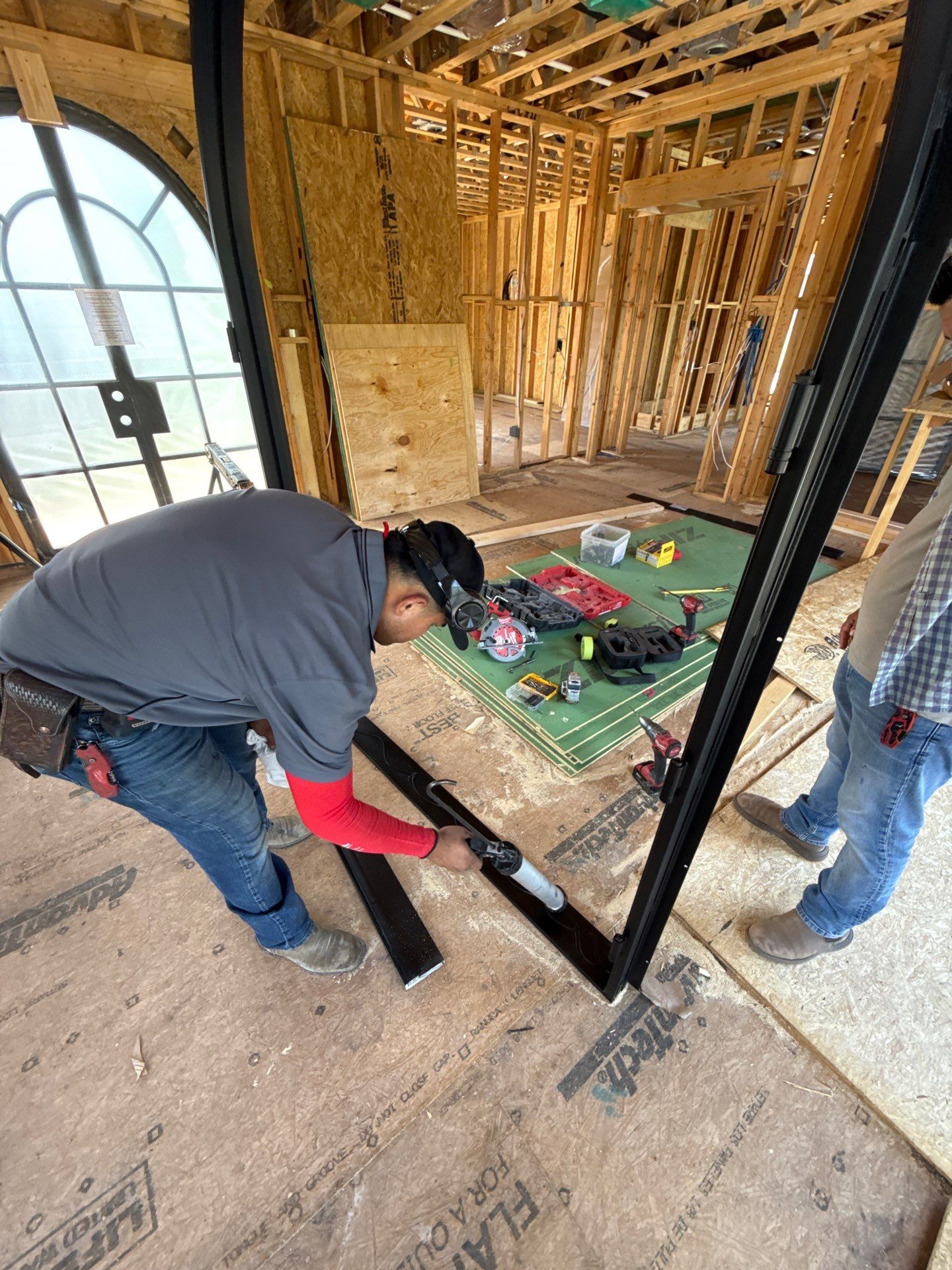 Arched Black Metal French Door Installation and Finishing in Fort Worth by Solara Custom Living
