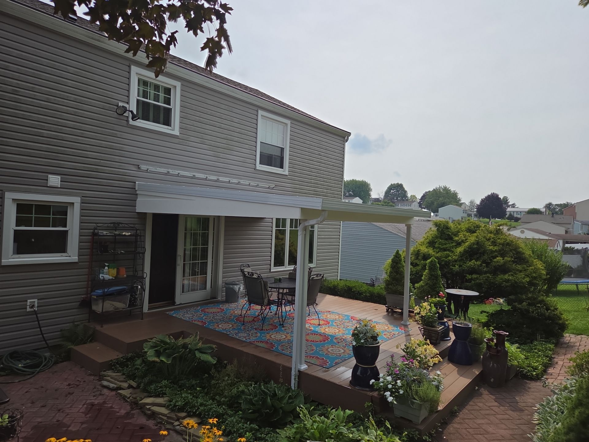 Composite Deck Build with Integrated Patio Cover in Washington by Cousins Roofing Siding & Decks