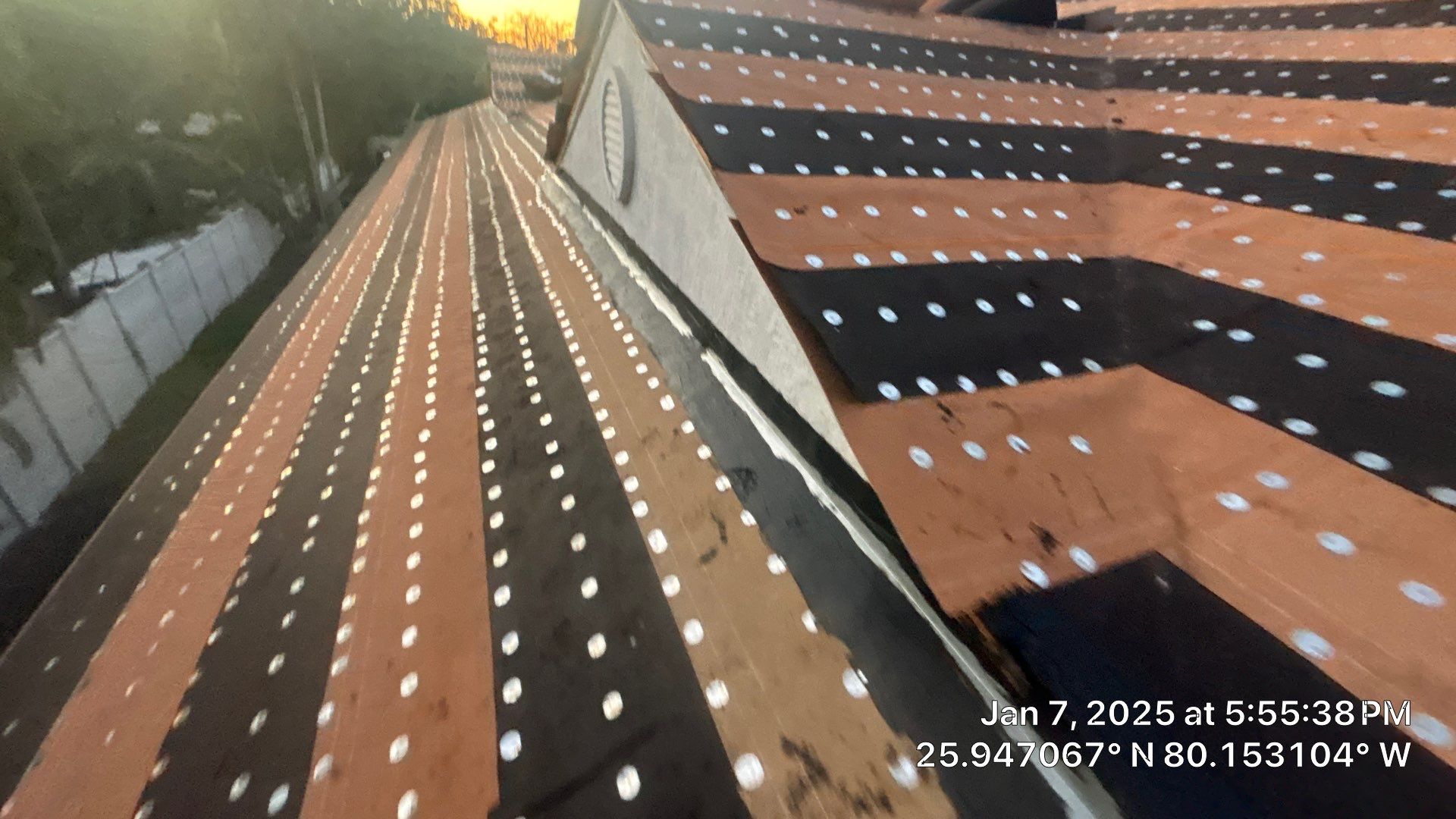 COMMERCIAL REROOF 24 GUAGE MEDIUM BRONZE 1-1/2" MECHANICAL SEAM "ZEBRA METHOD" by Earl W. Johnston Roofing 
