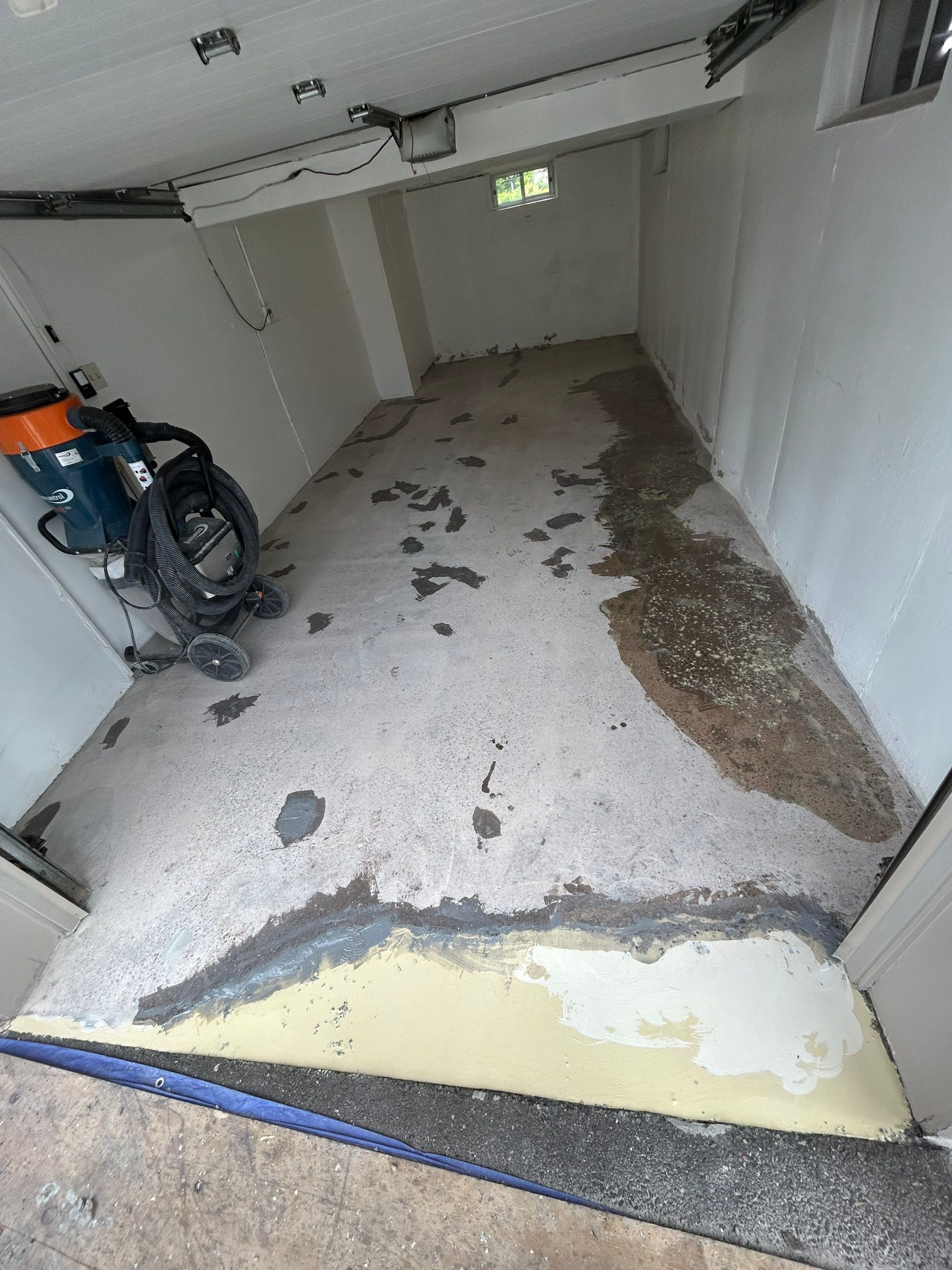 Garage Concrete Floor Coating Transformation  by DiGiorgi Roofing and Siding Inc