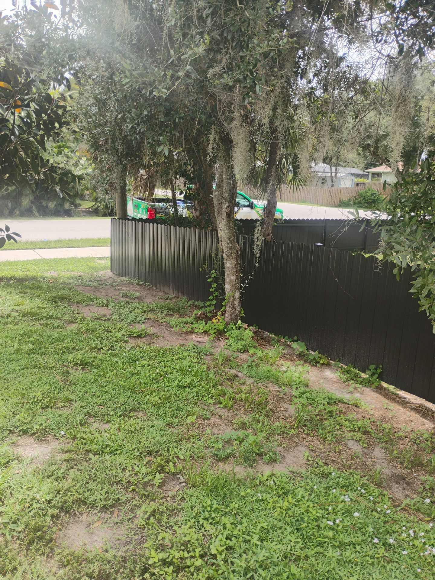 Bronze Scalloped Metal Privacy Fence Installation in North Port by True Fence LLC