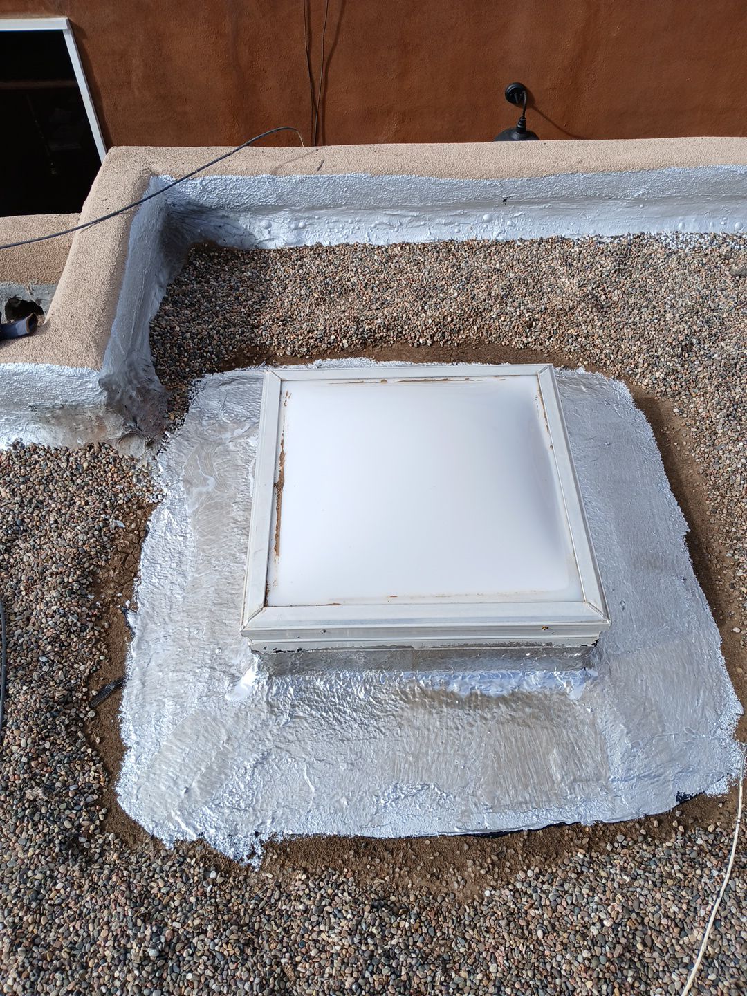Roof Maintenance and Low-E Tempered Glass Skylight Replacement on Gravel Roof in Northwest Albuquerque by Doyle Roof Masters Inc