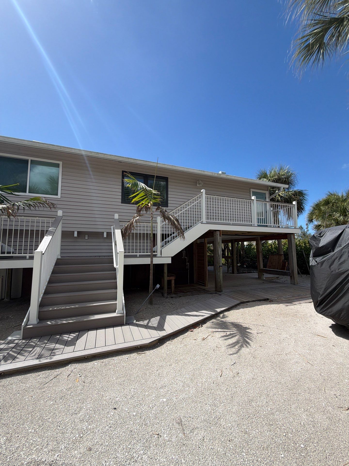 Elevated Deck and Composite Staircase Replacement in Placida Florida by Smirnov Construction Inc