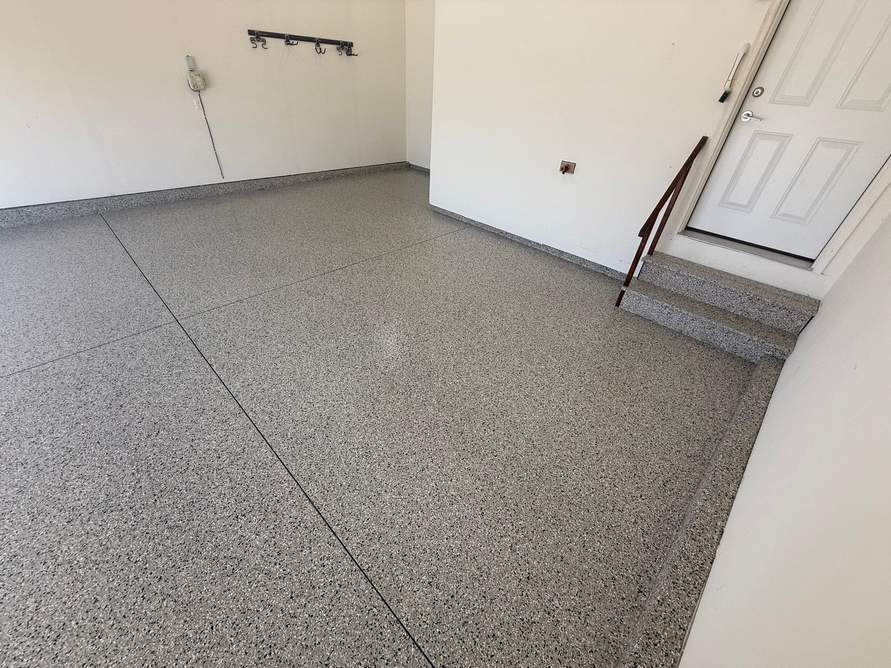 Cabin Fever Garage Floor Coating in Sioux Falls by Select Painting, Coatings & Garage Cabinets