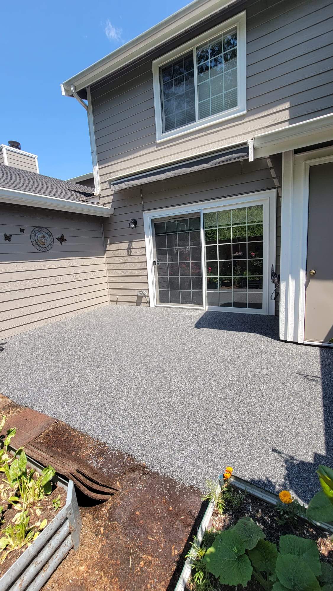 Urban Elegance Back Patio in Manhattan Vuba Stone by Concrete Coating Experts Inc.