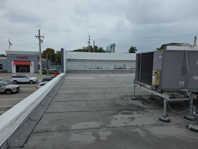 Commercial Flat Roof Restoration Using Silicone Coating in Hallandale Beach