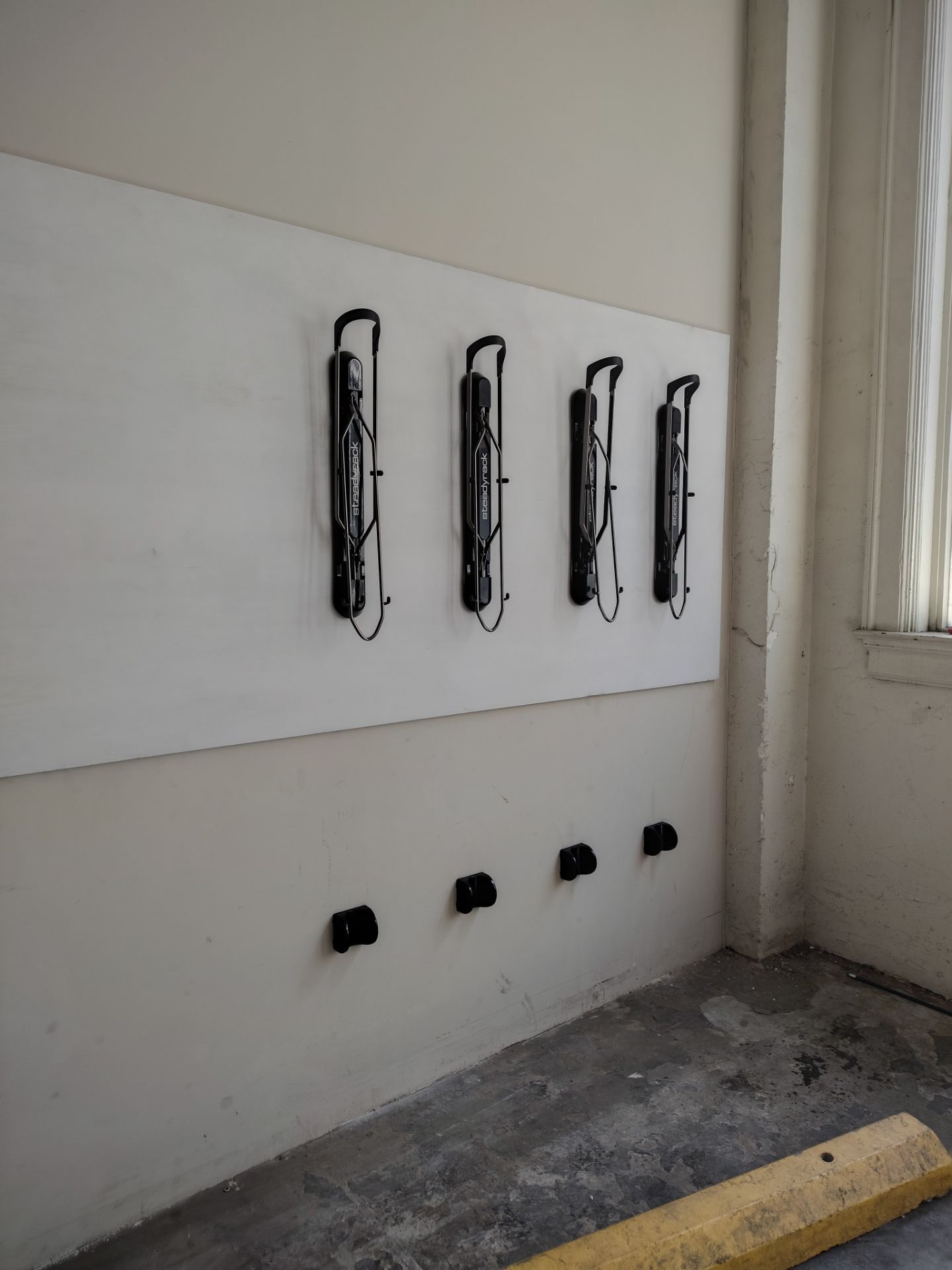 Wall bike rack installtion by King Cole Construction