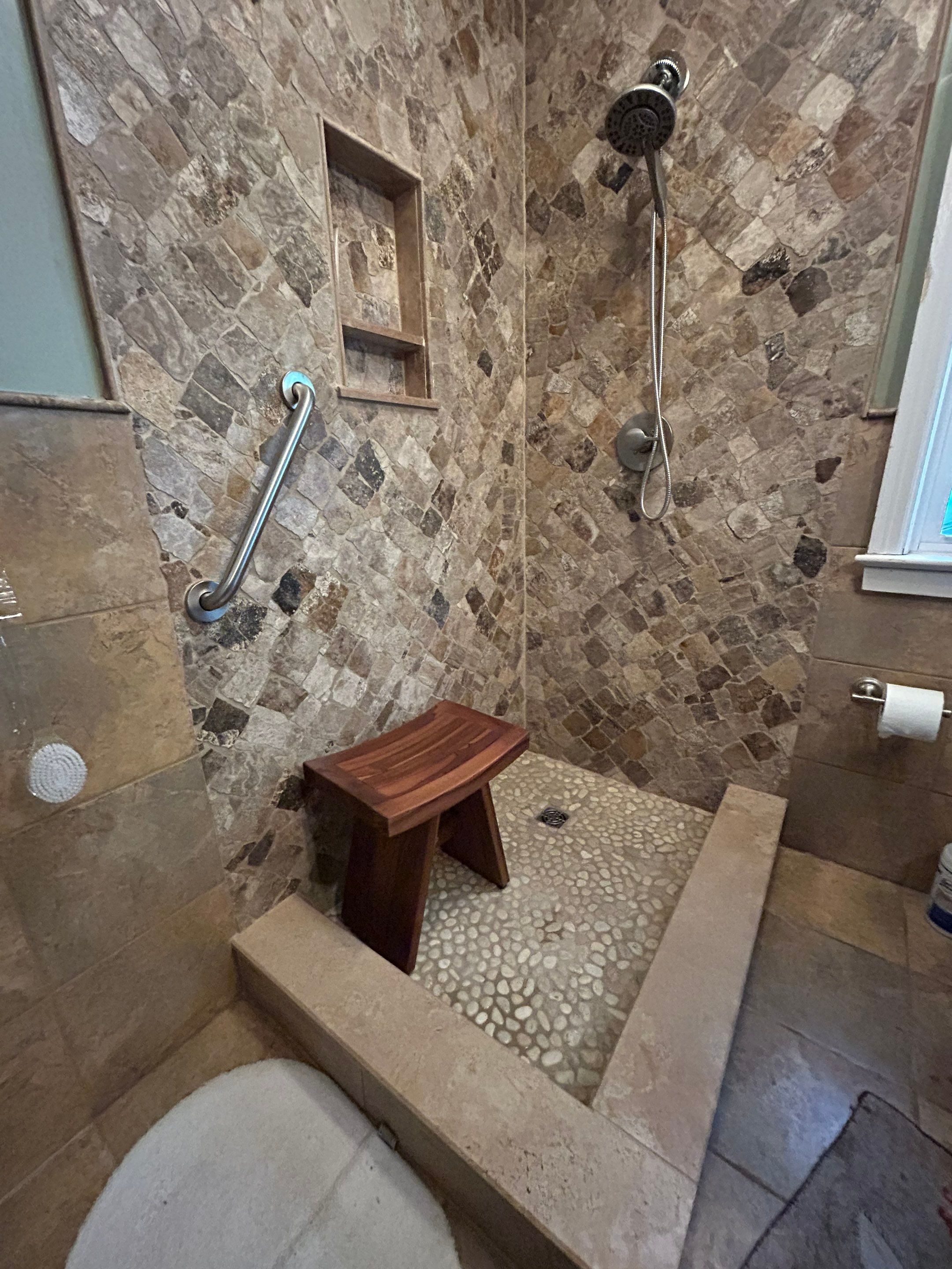 Natural Stone Shower Remodel and Pebble Floor Installation in Louisville by Footprints Floors Kentucky
