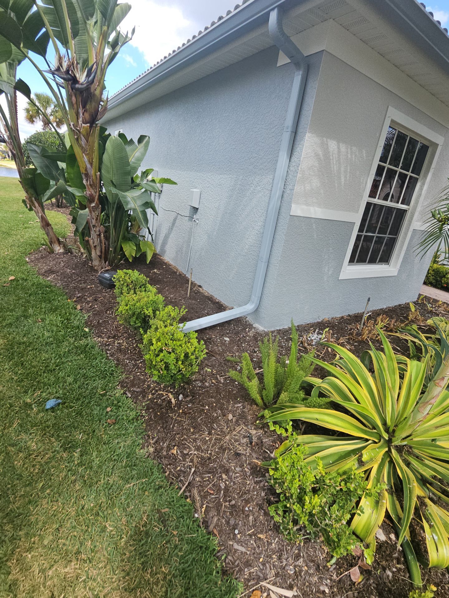 6-inch K-style Seamless Gutters and Splash Guard in Grey Color in Naples FL by Gutter Professors