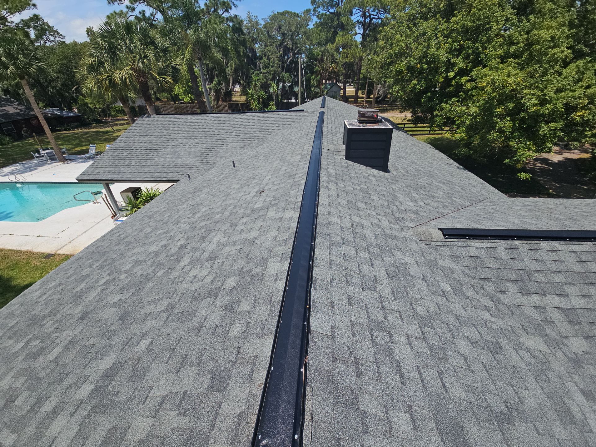 Roof Replacement with Architectural Shingles and Chimney Repair in Cocoa by Wiedmann Construction & Roofing