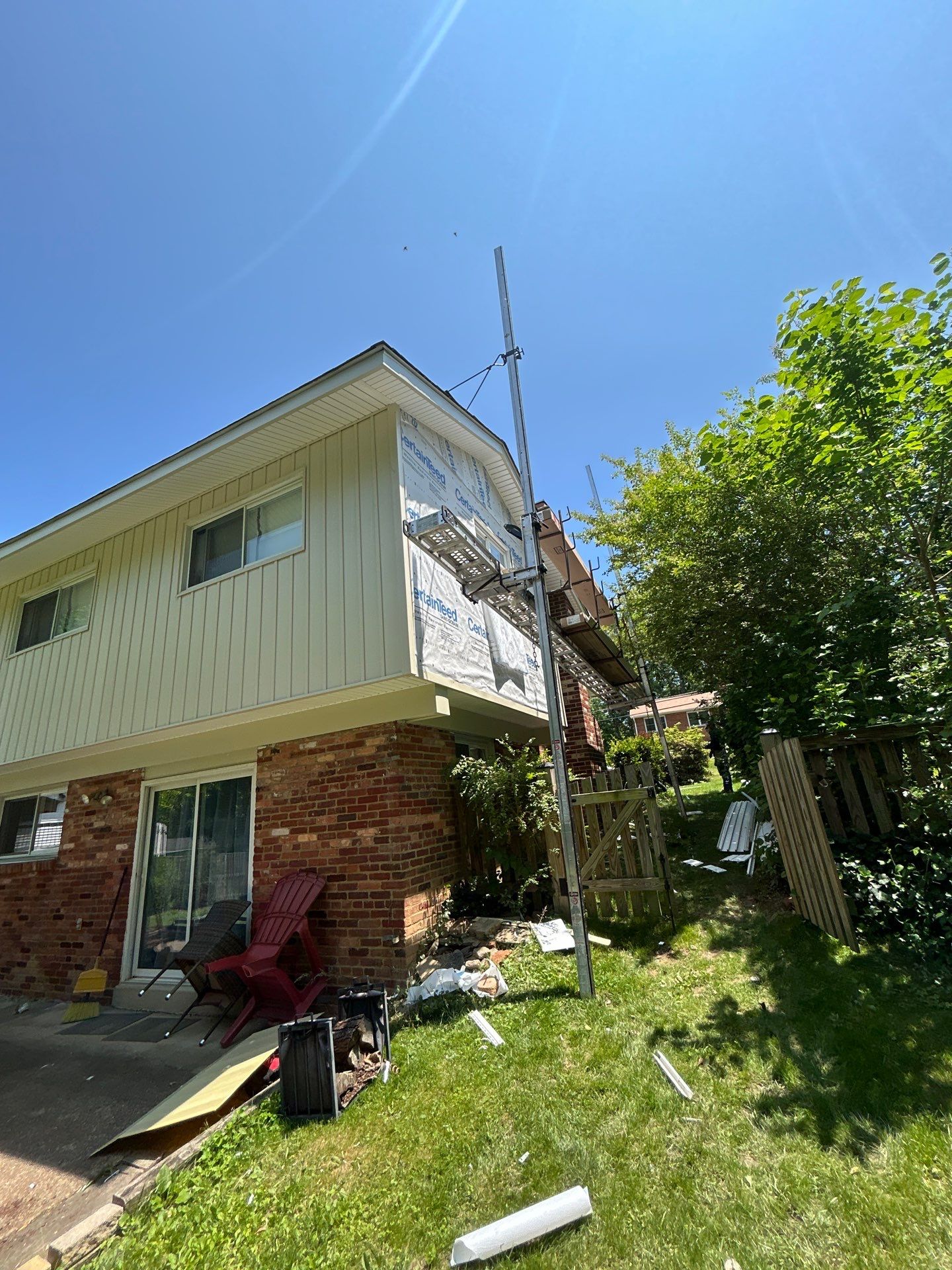 Fairfax: Residential Siding Replacement with CertainTeed 8" Board and Batten Siding in Desert Tan by RM Banning, Inc.