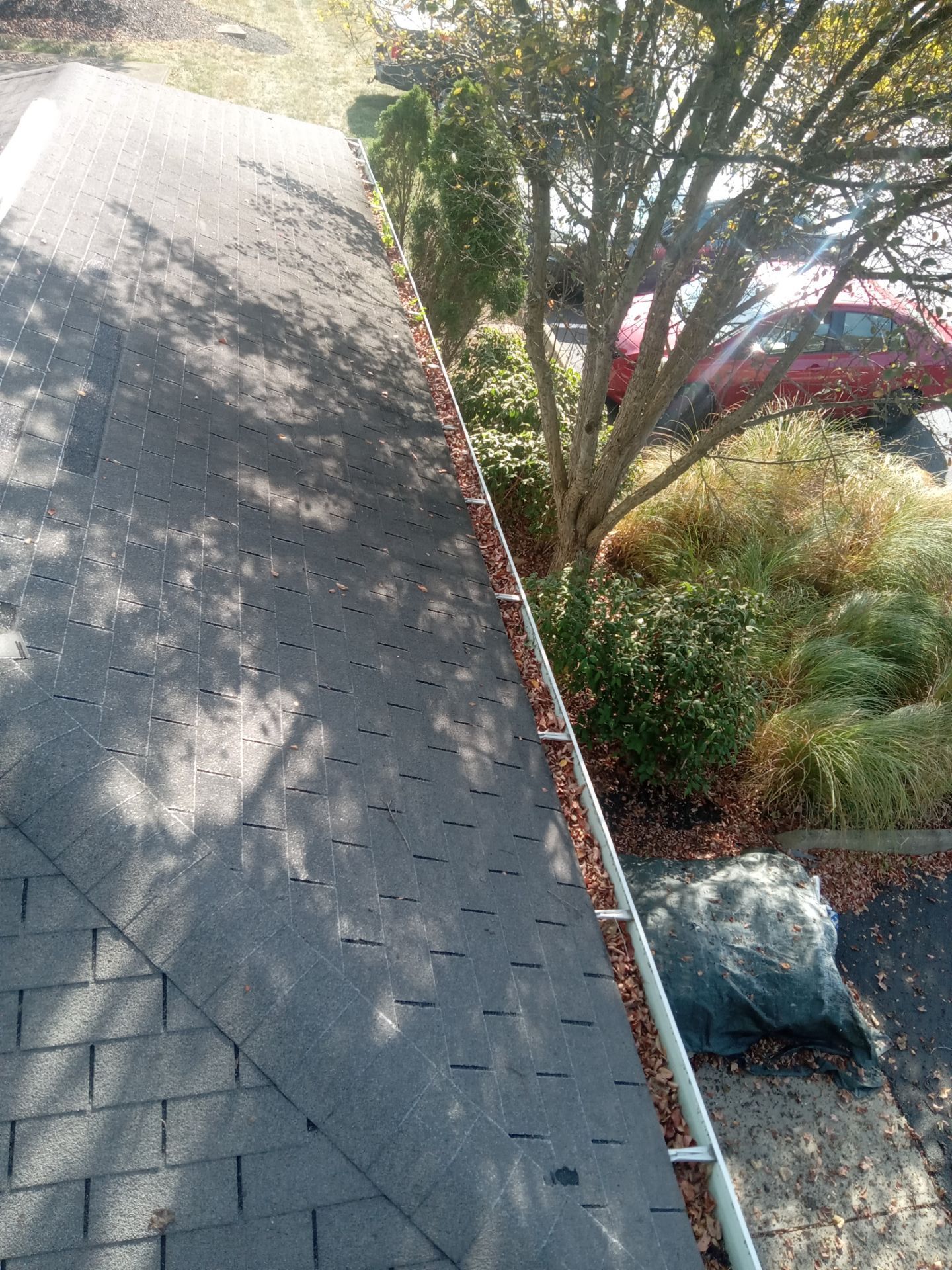 Commercial gutter cleaning Cincinnati before photo with filled gutters