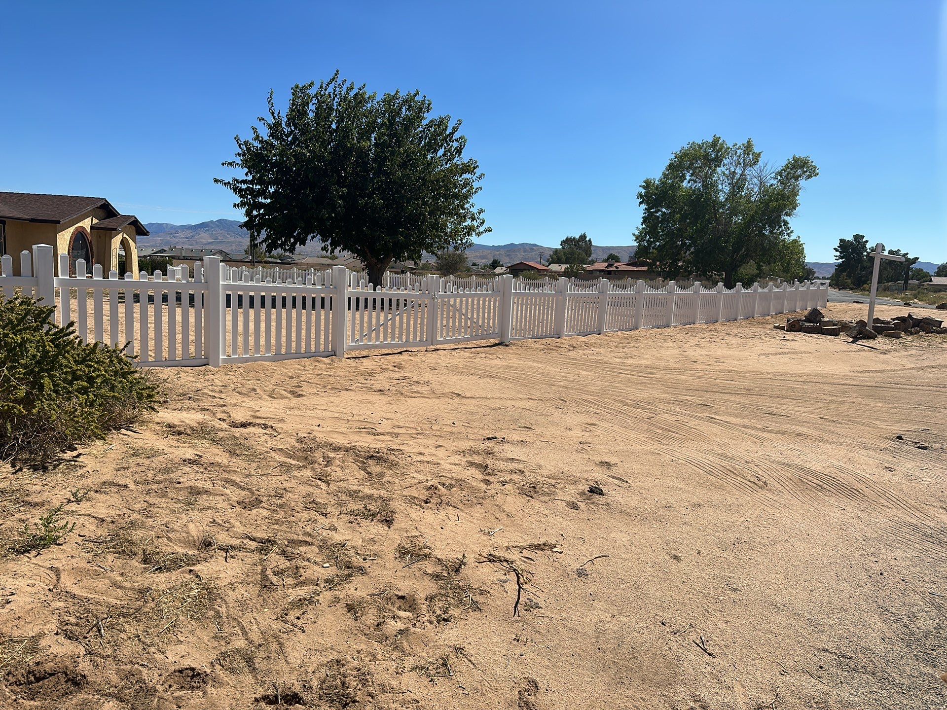 White picket fence  by Fence Guys Inc. 