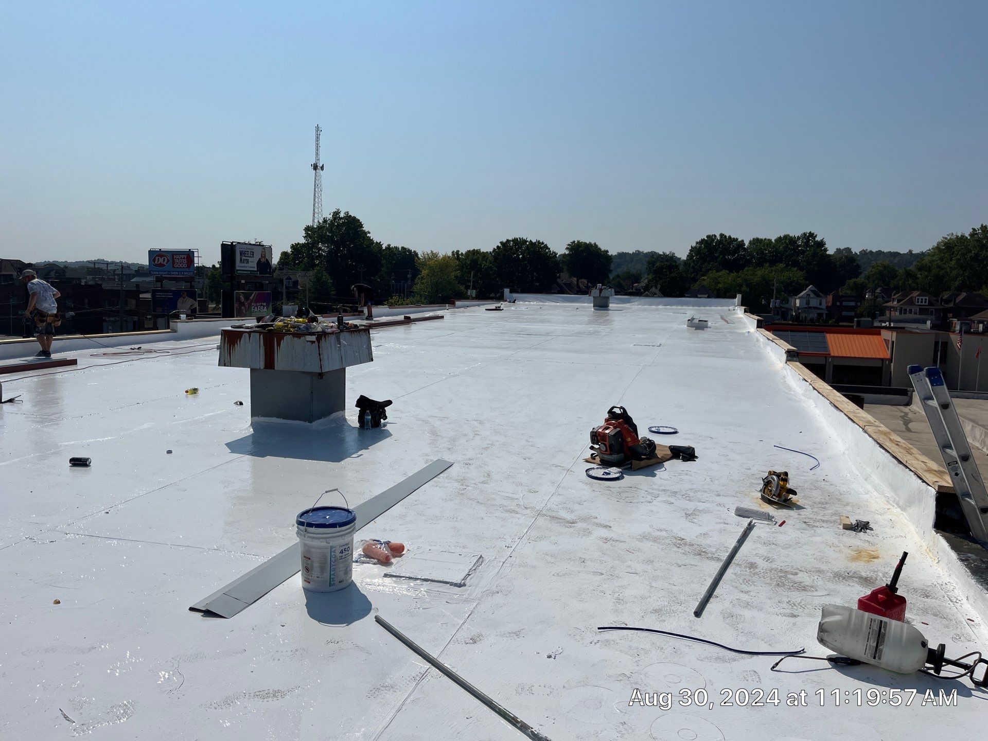 Commercial Roofing Installation using smartcoat Roof coating by Fahey Roofing + Contracting