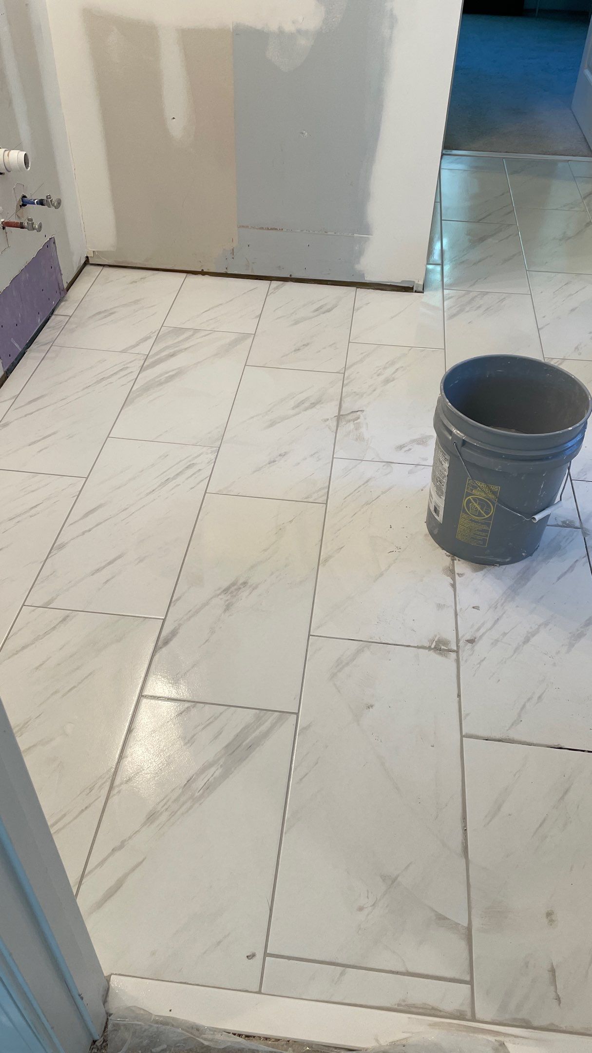 Bright Bathroom Remodel with Wall Removal, Stand Alone Tub and New Vanity by Footprints Floors of Coastal Carolina