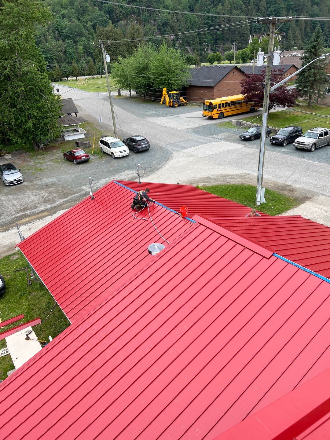 Commercial Roofing Installation using 12" Prolok metal  by Top Notch Roofing Inc