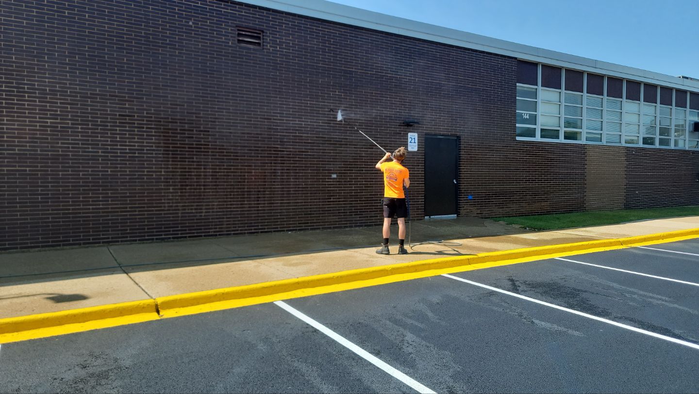 commercial pressure washing using Algaecide, soft wash soap by Northern Power Washing LLC.