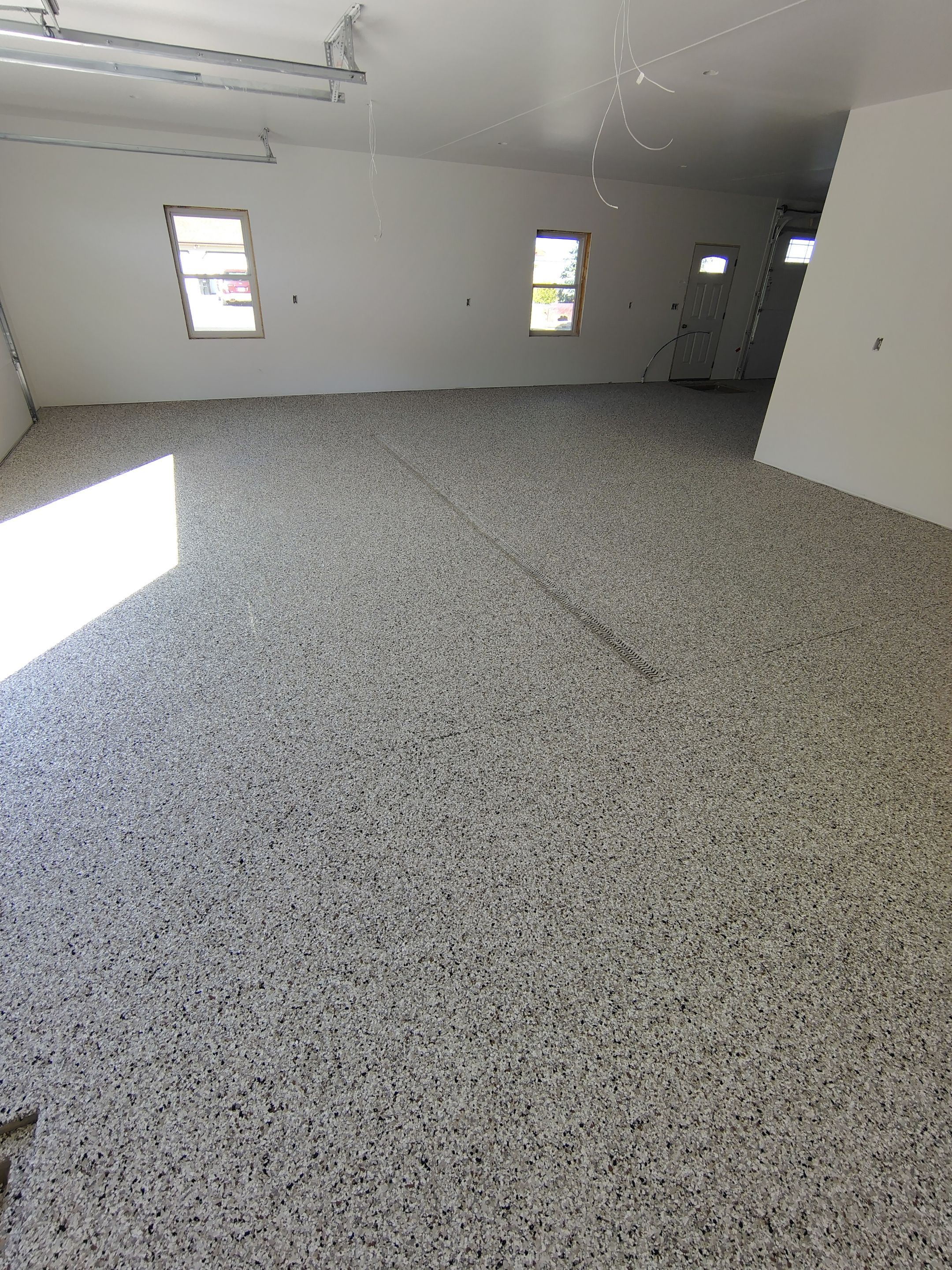 Custom Garage and Basement Epoxy Floor Coating in Menno by Select Painting, Coatings & Garage Cabinets