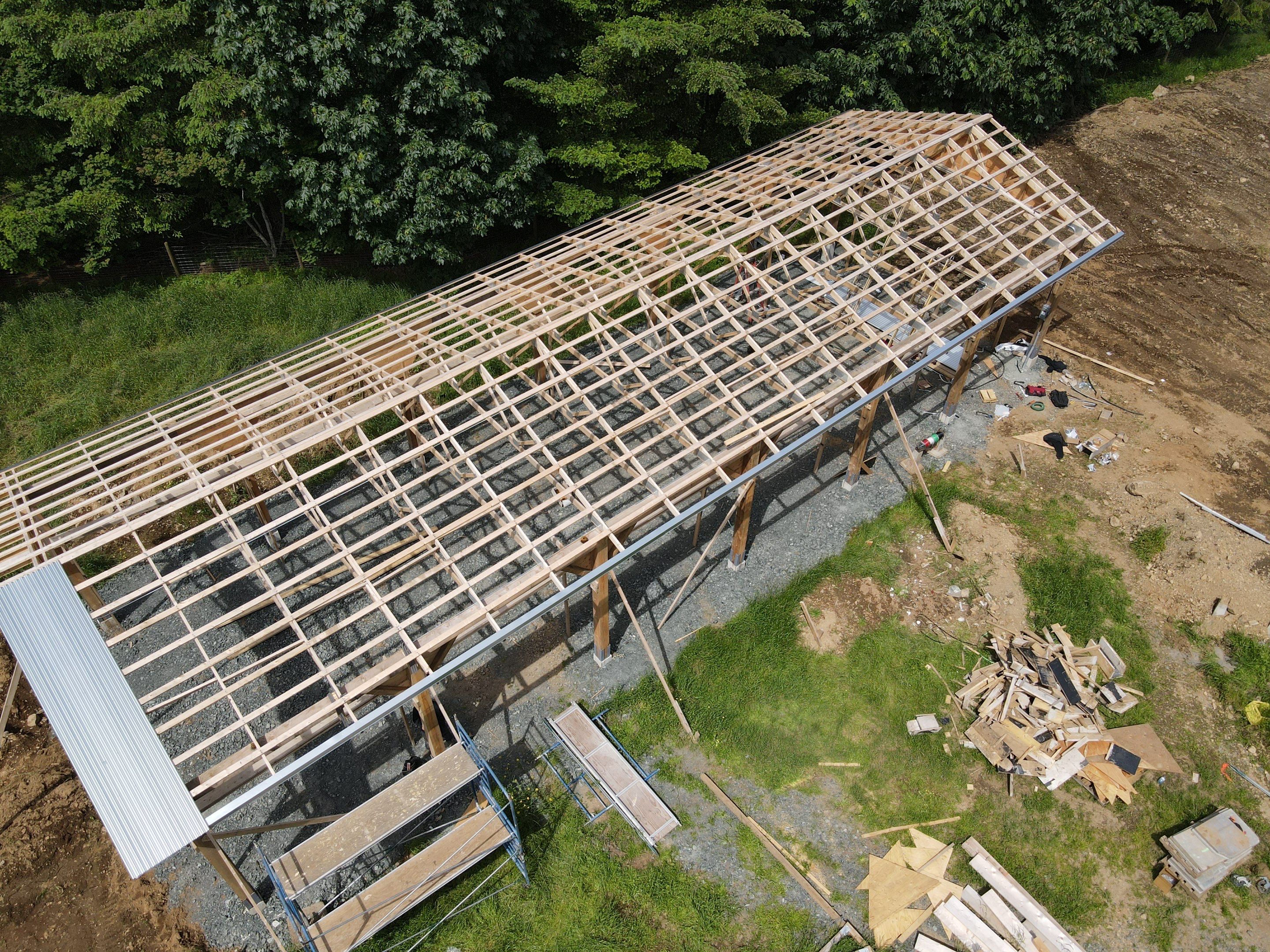 Commercial Roofing Installation using corrugated metal by Top Notch Roofing Inc