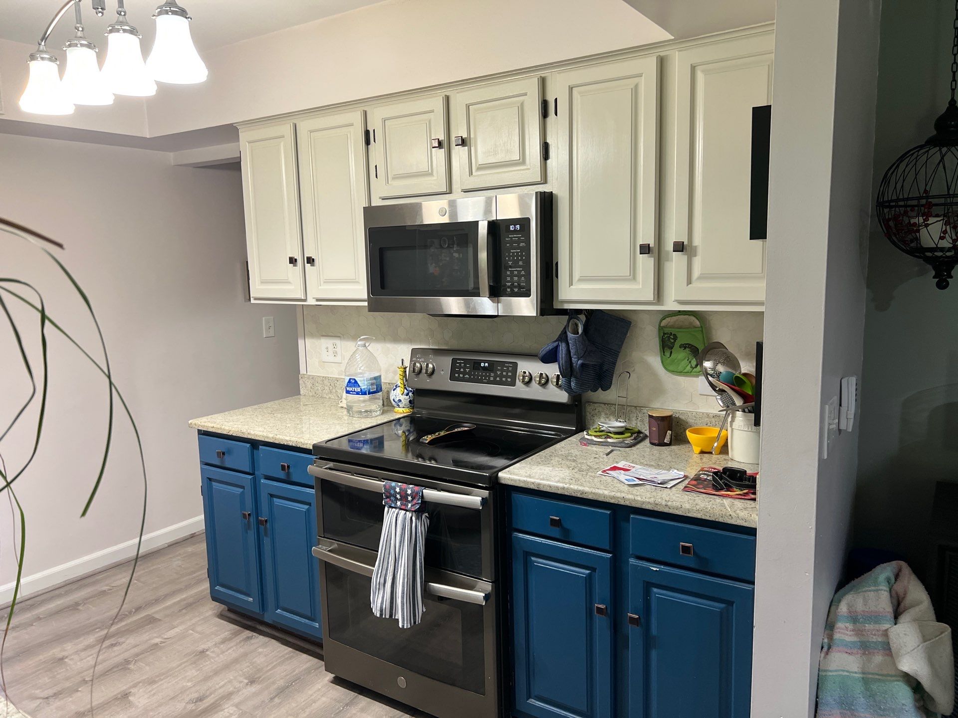 Two-Tone Kitchen Cabinet Refinishing and Granite Countertop Installation by Top Shelf Painter